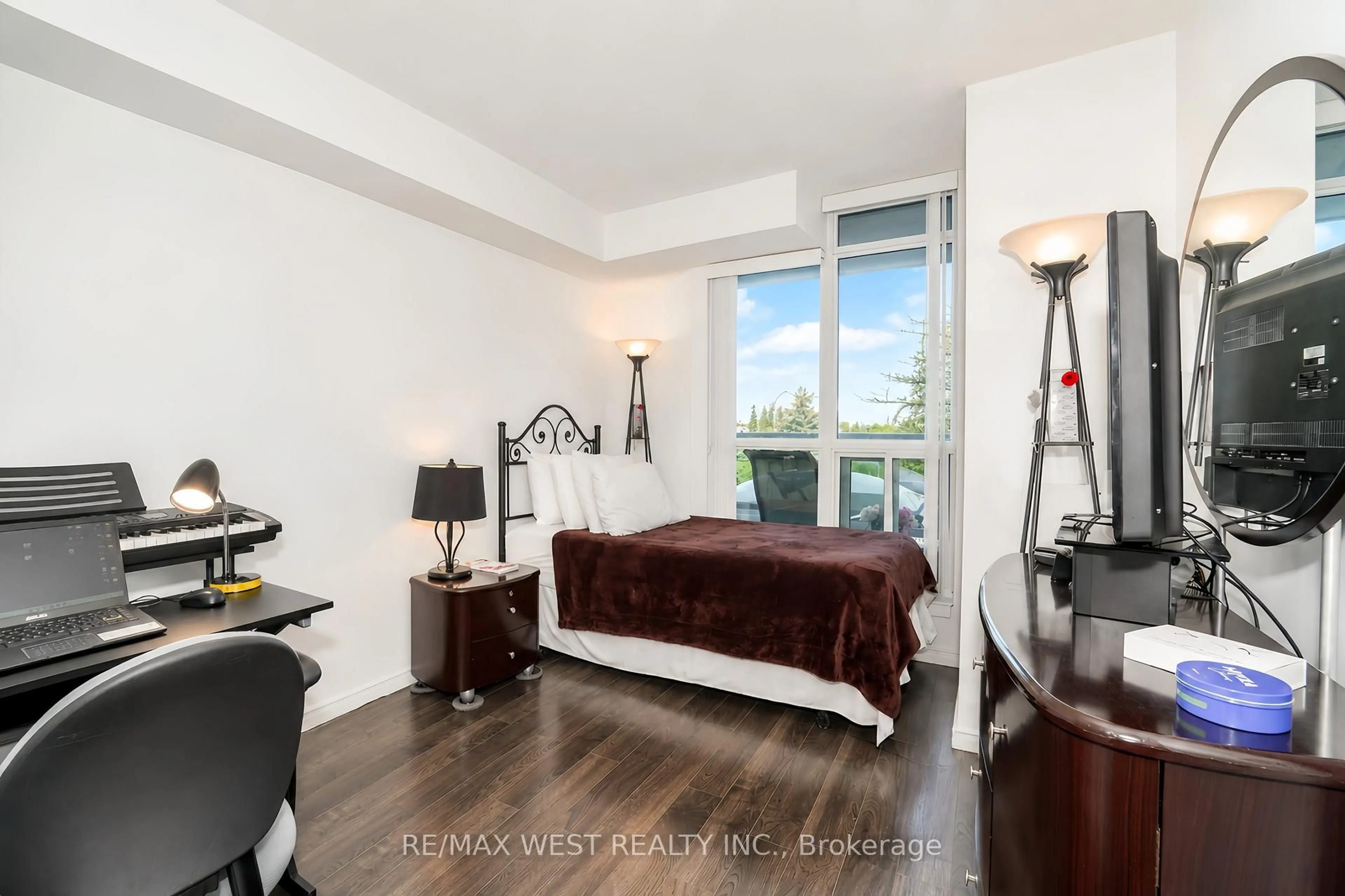 Bedroom with bed, wood/laminate floor for 340 Watson St #216, Whitby Ontario L1N 9G1