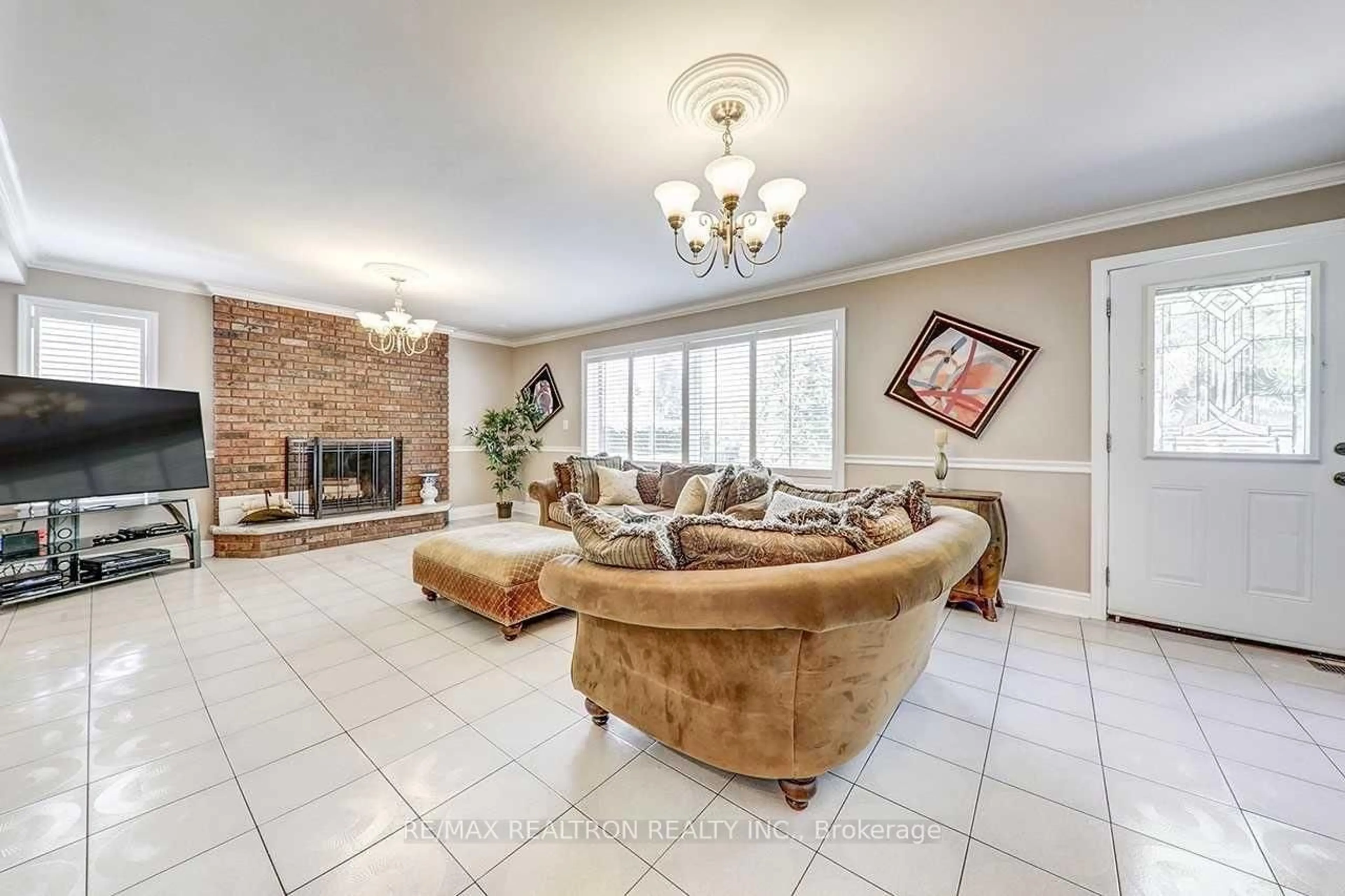 Living room with furniture, ceramic/tile floor for 117 Dunsfold Dr, Toronto Ontario M1B 1T5