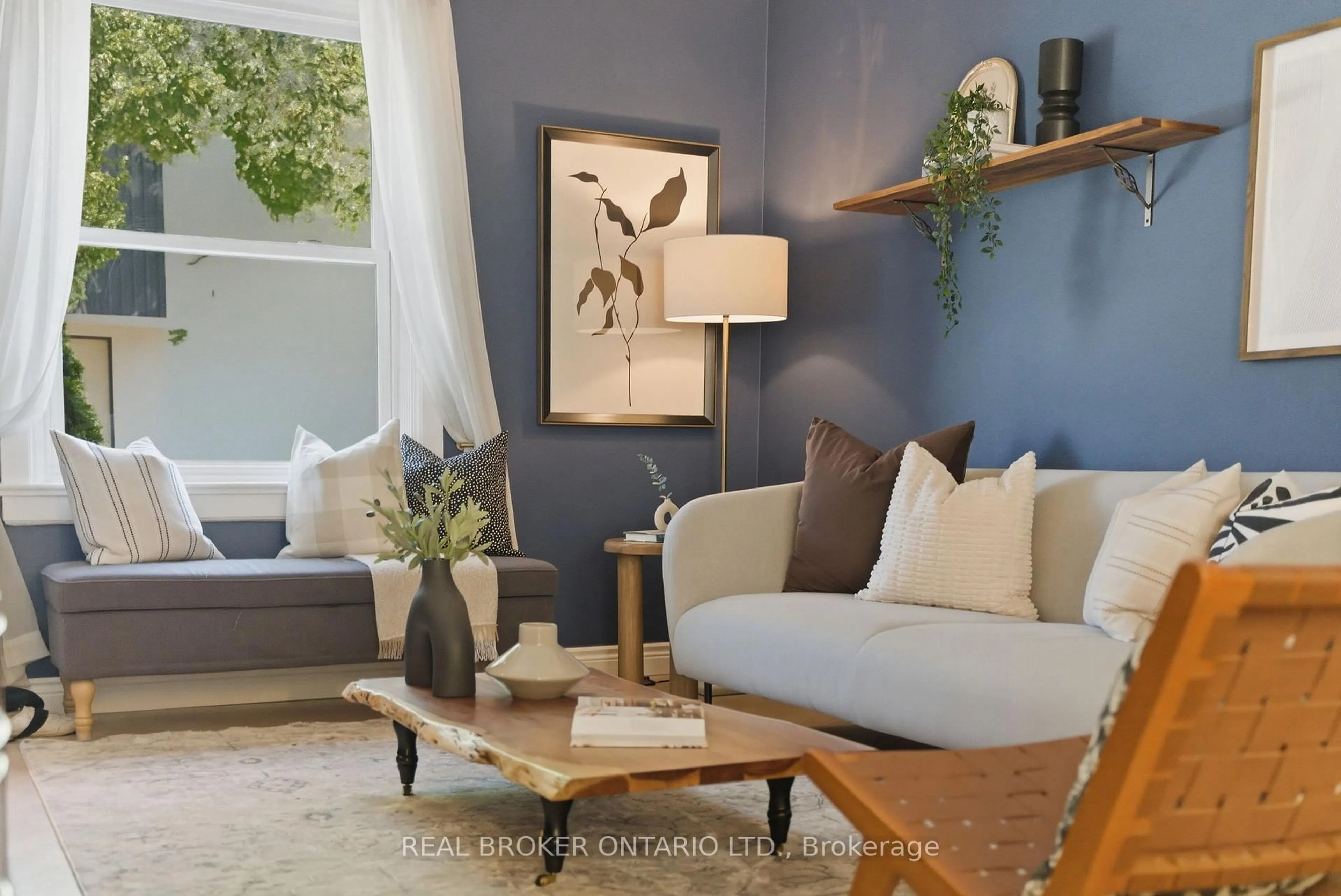 Living room with furniture, wood/laminate floor for 833 Sammon Ave, Toronto Ontario M4C 2E7