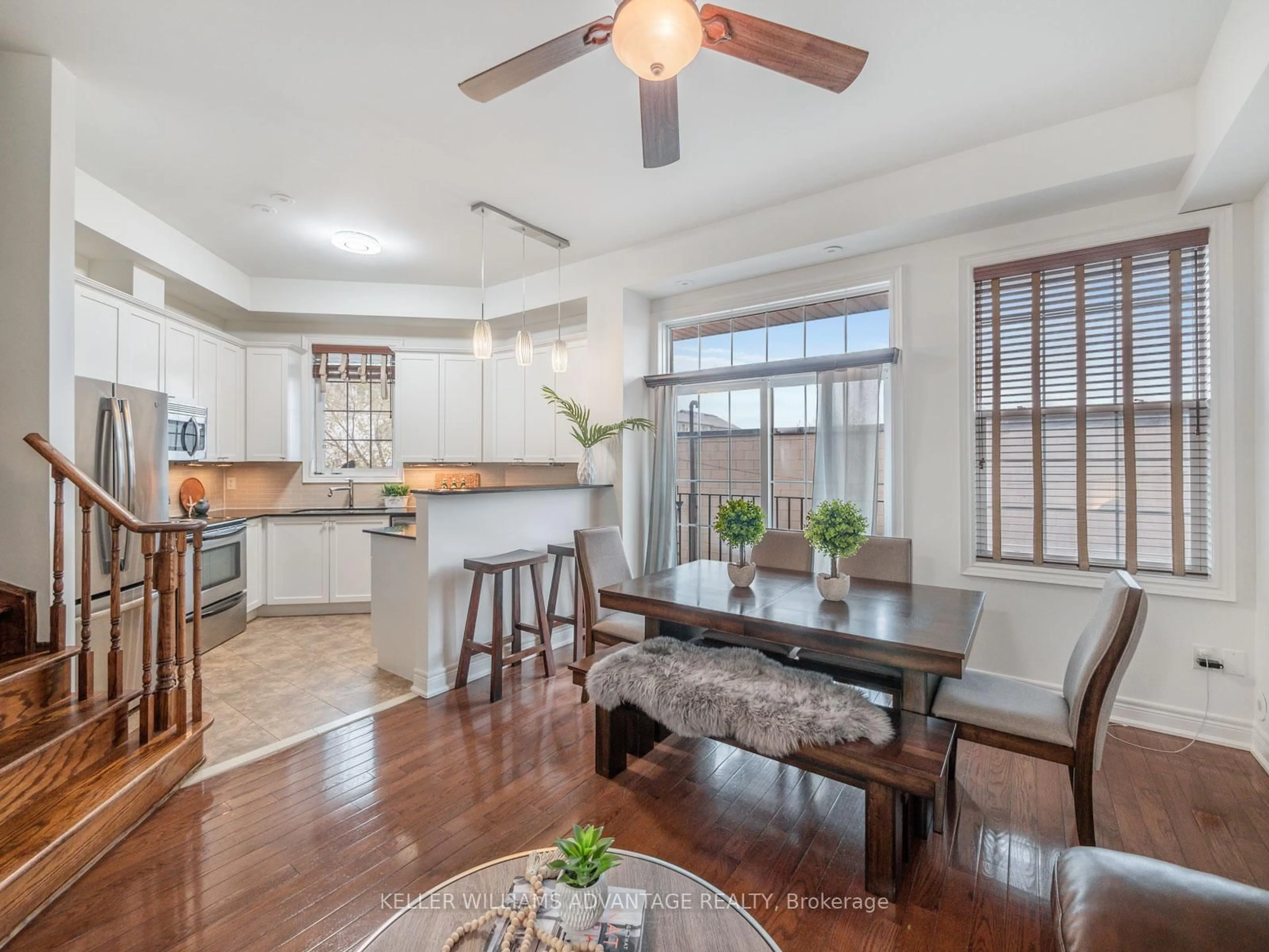 Open concept kitchen, wood/laminate floor for 34 Fairhead Mews, Toronto Ontario M4E 3Y4