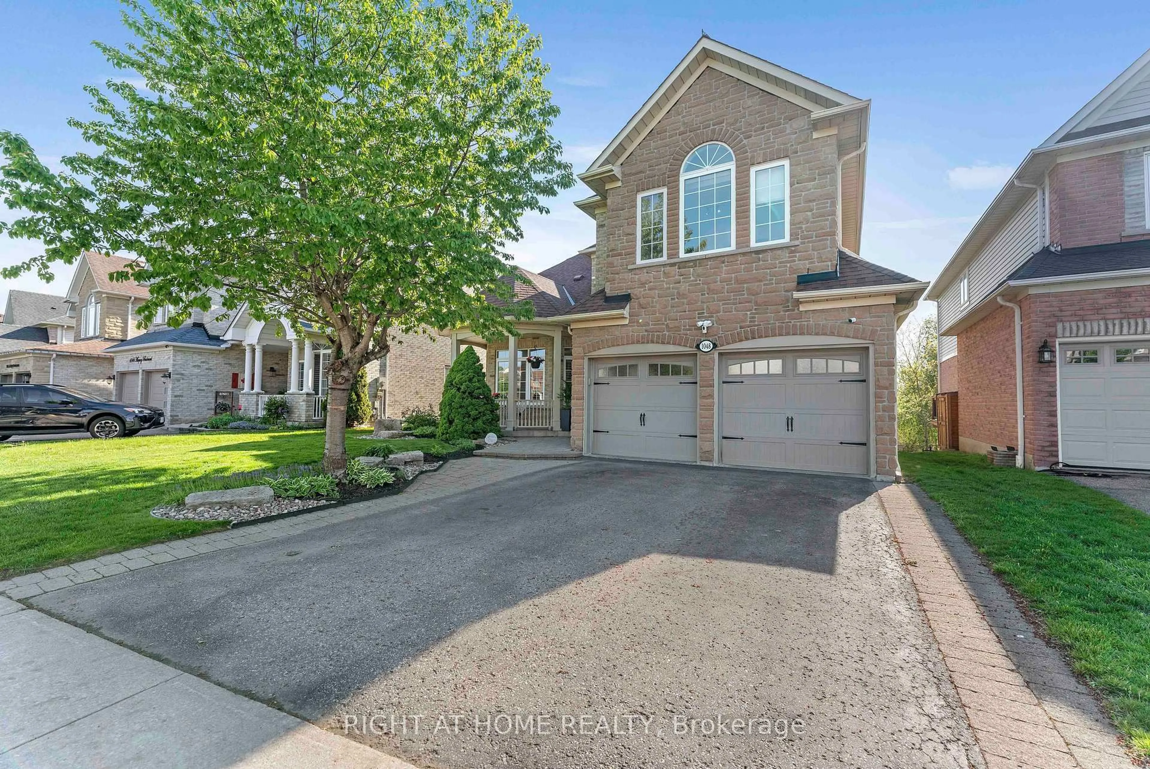 Home with brick exterior material, street for 1048 Mcquay Blvd, Whitby Ontario L1P 1R8