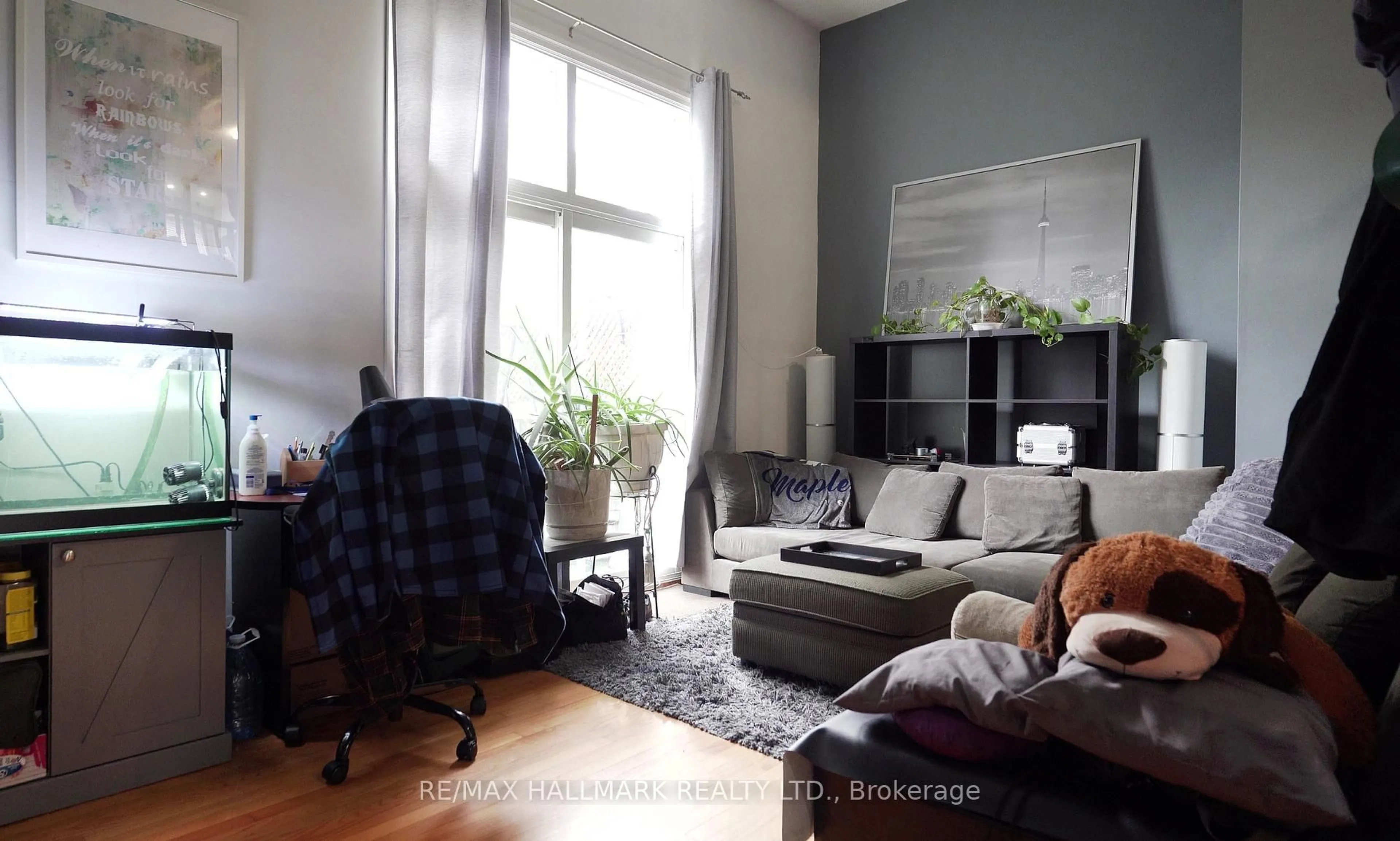 Living room with furniture, wood/laminate floor for 1330 Trowbridge Dr #42, Oshawa Ontario L1G 7L1