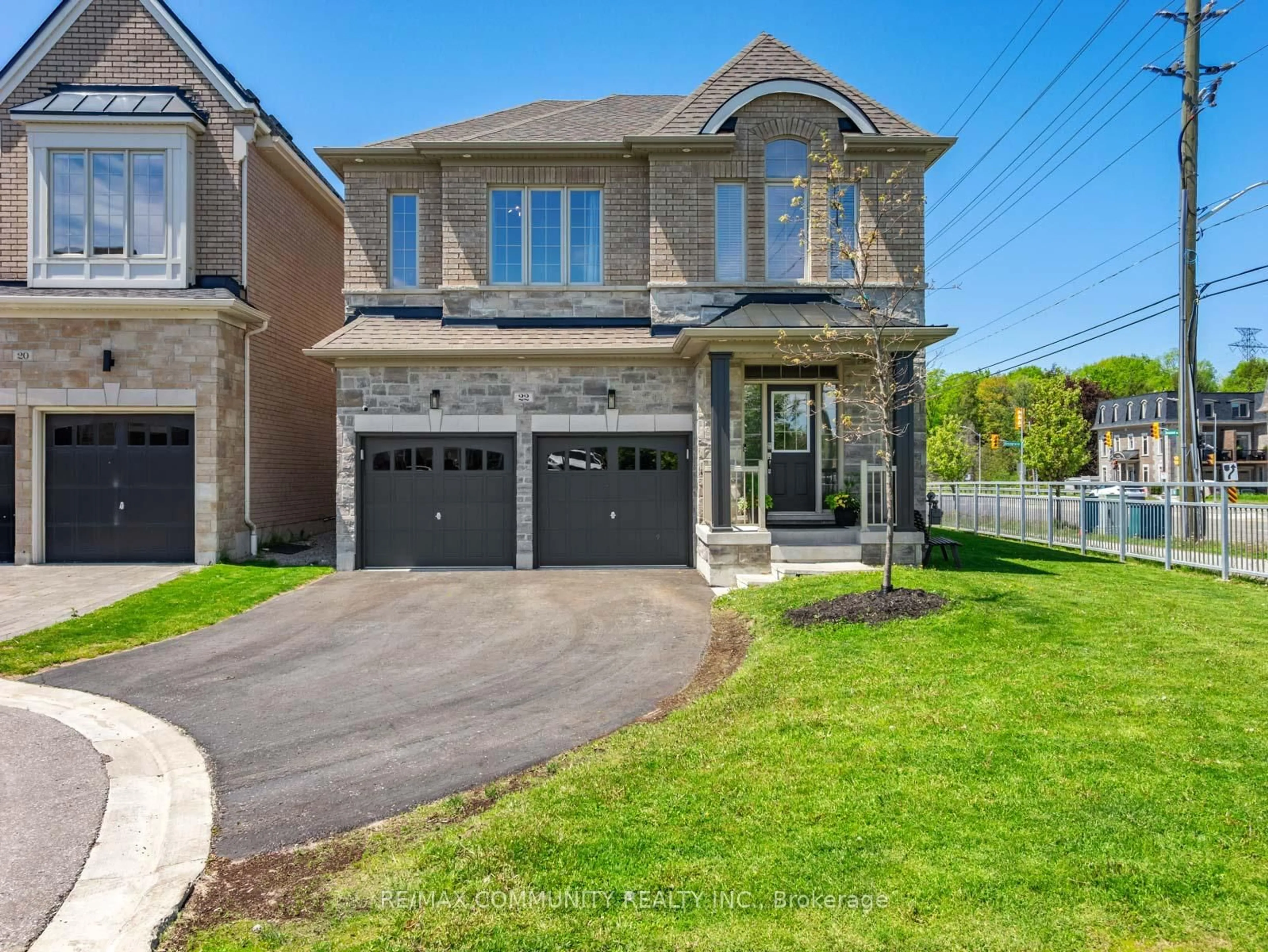 Home with brick exterior material, street for 22 Coates Of Arms Lane, Ajax Ontario L1T 3S2