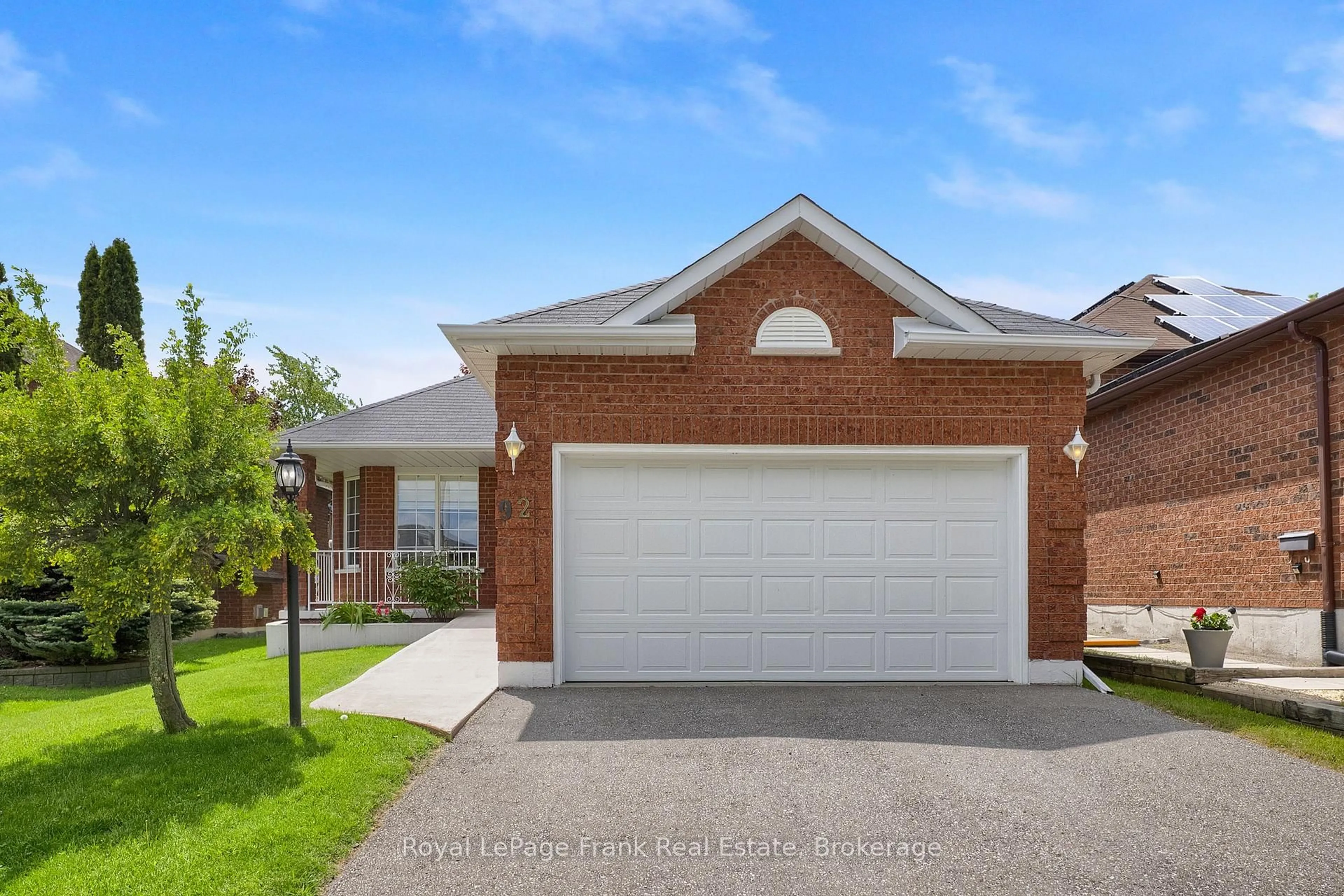 Home with brick exterior material, street for 92 West Side Dr, Clarington Ontario L1C 4Y9