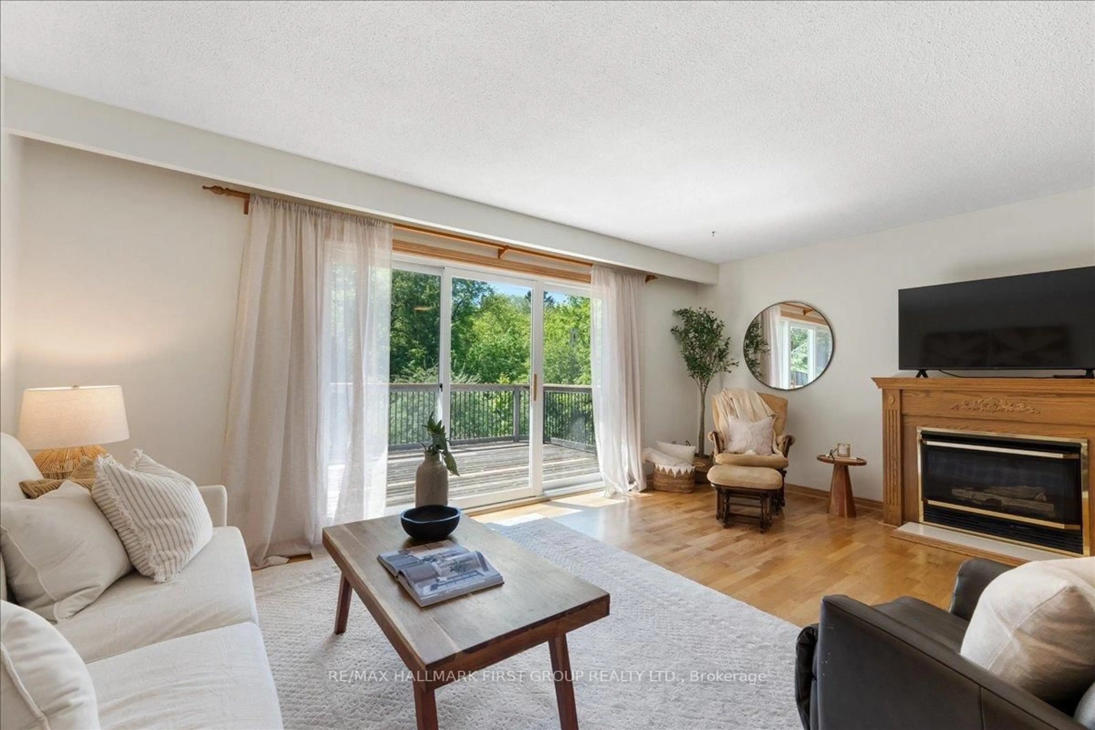 Living room with furniture, wood/laminate floor for 104 Marwin Rd, Ajax Ontario L1S 6J5