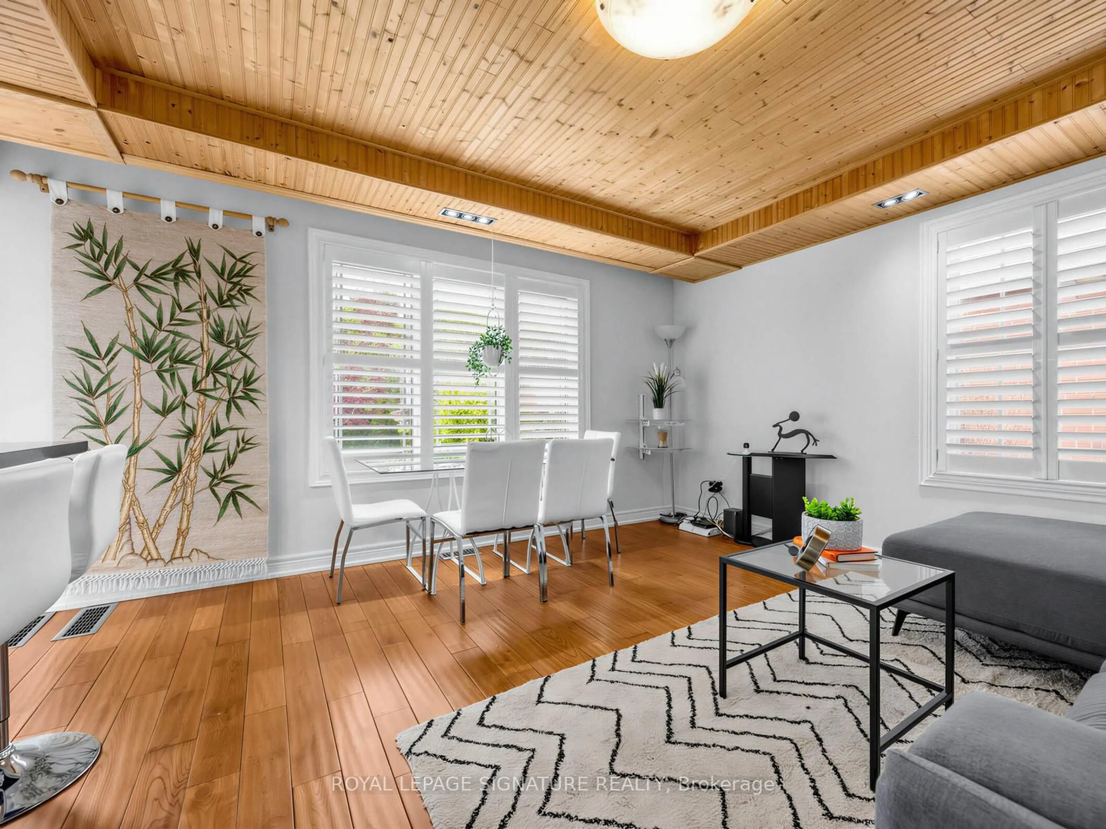 Living room with furniture, wood/laminate floor for 67 Ellington Dr, Toronto Ontario M1R 3Y2