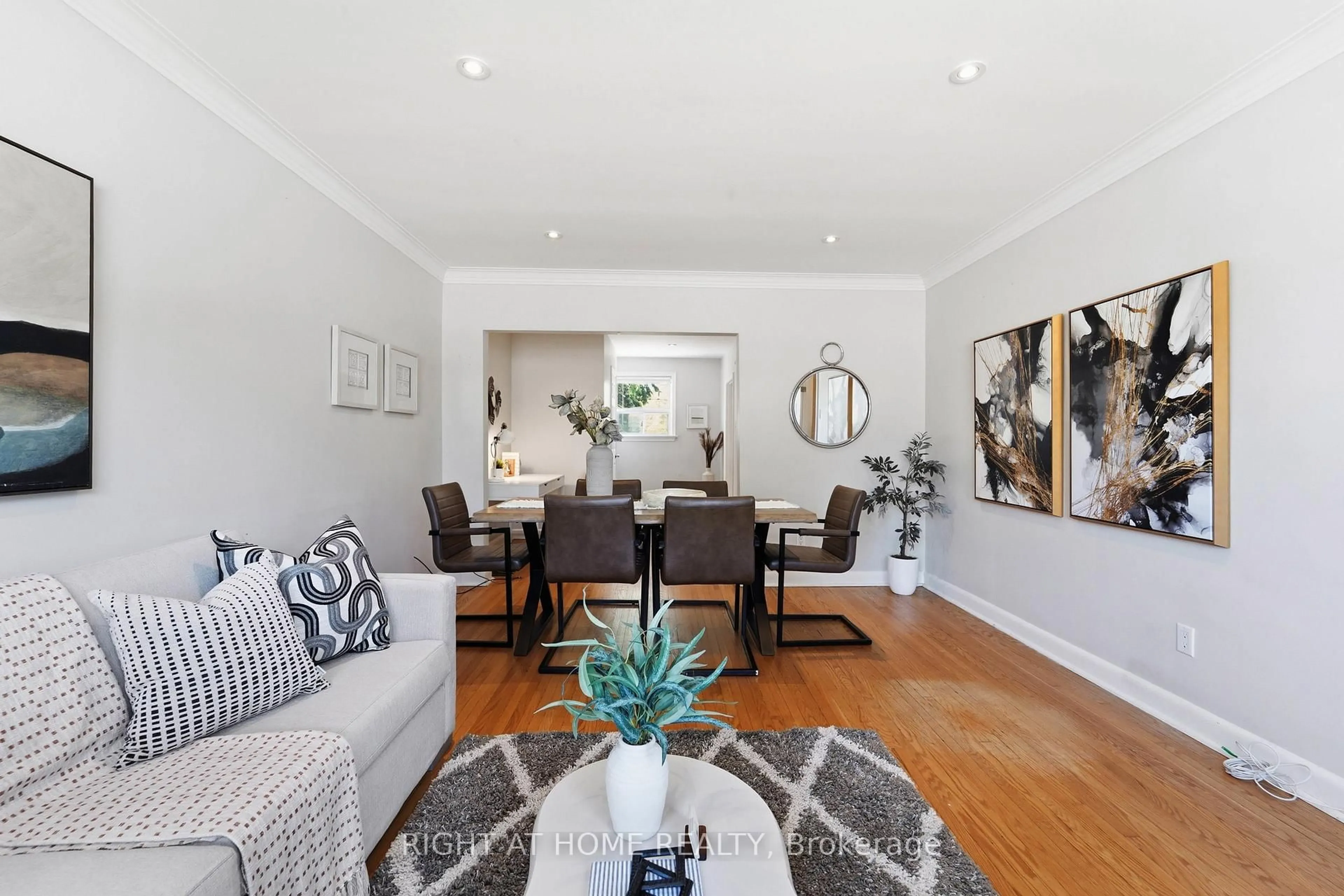 Living room with furniture, wood/laminate floor for 615 Pharmacy Ave, Toronto Ontario M1L 3H1