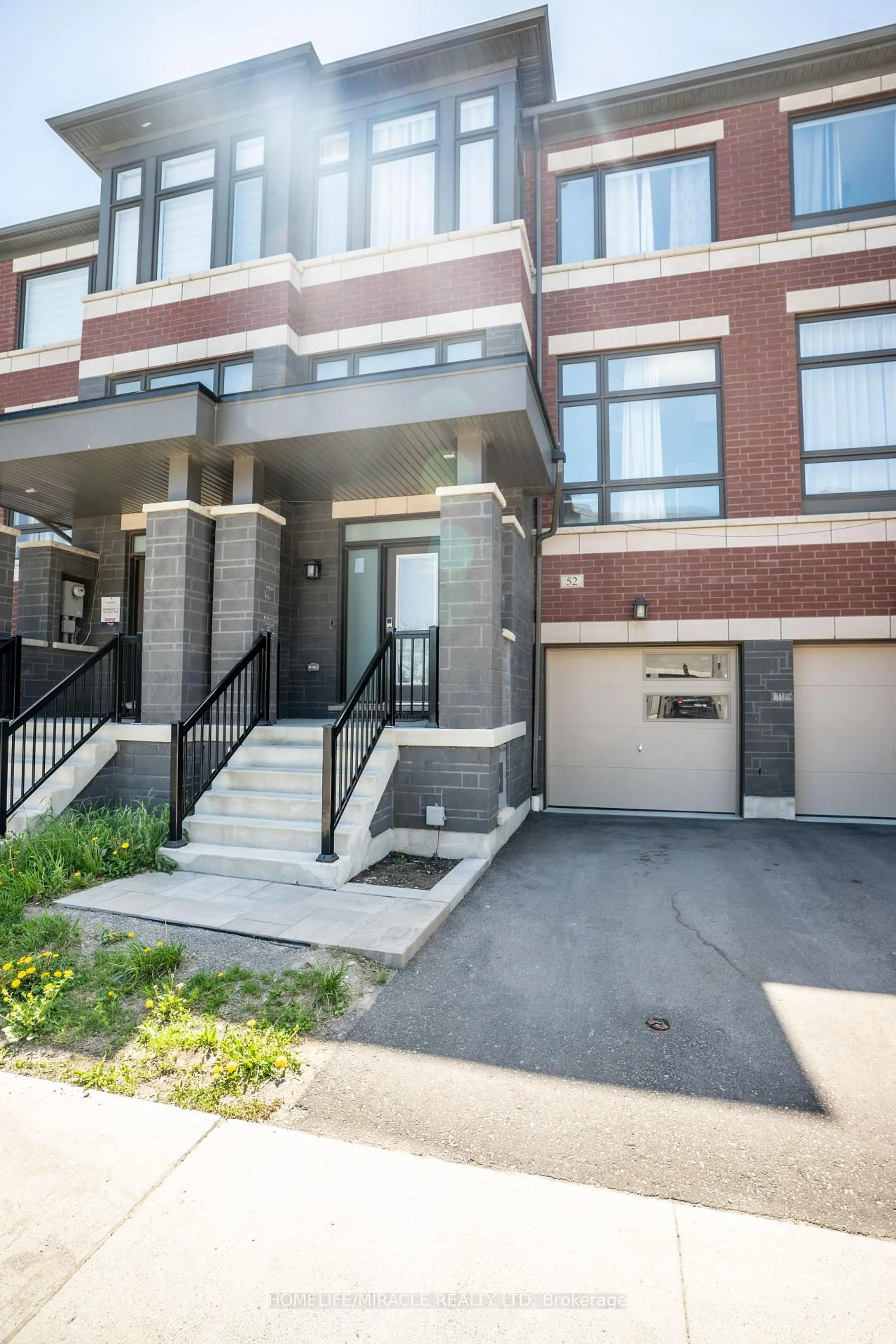 Home with brick exterior material, street for 52 Douet Lane, Ajax Ontario L1Z 0V4