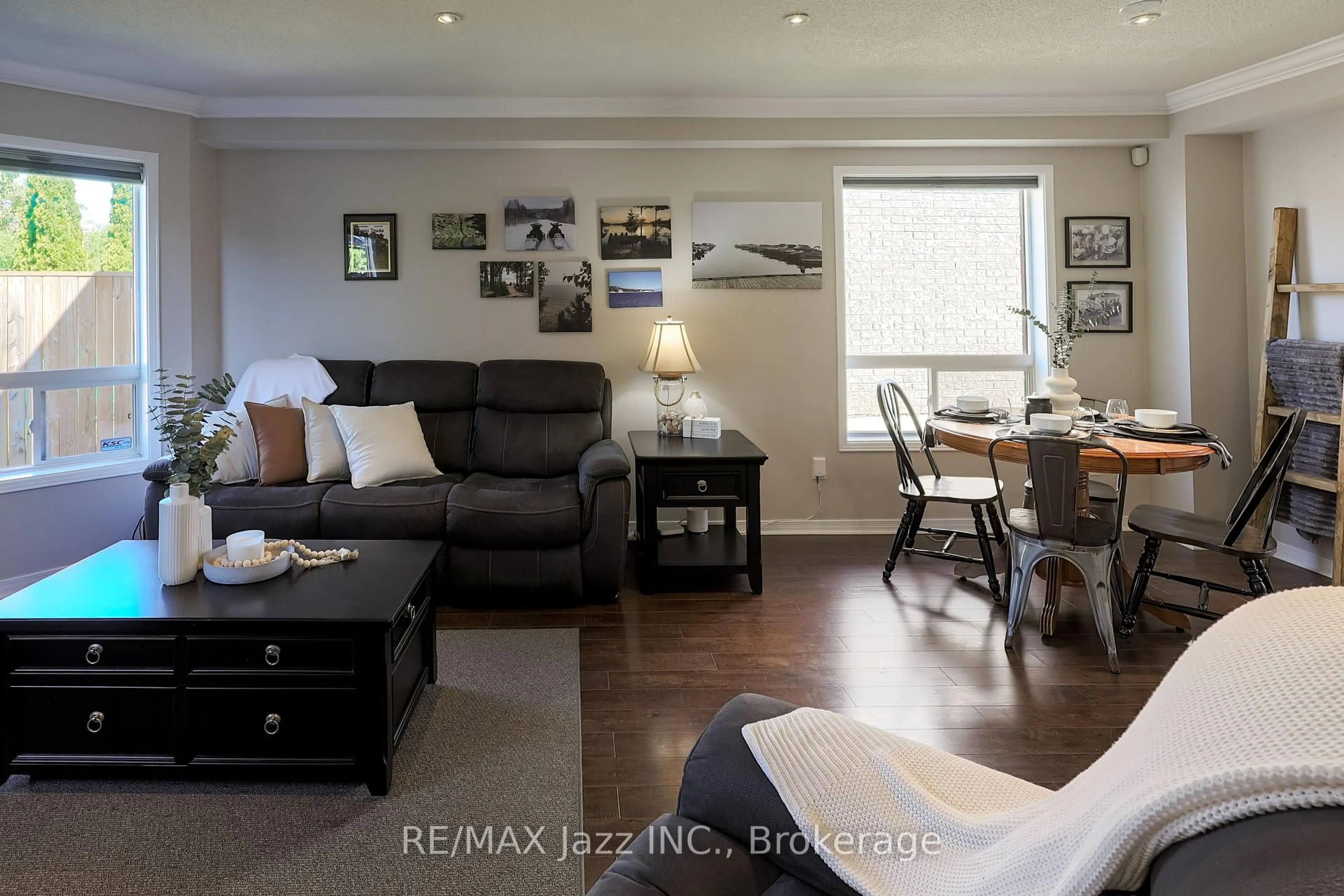 Living room with furniture, wood/laminate floor for 104 Calwell Dr, Scugog Ontario L9L 1T7