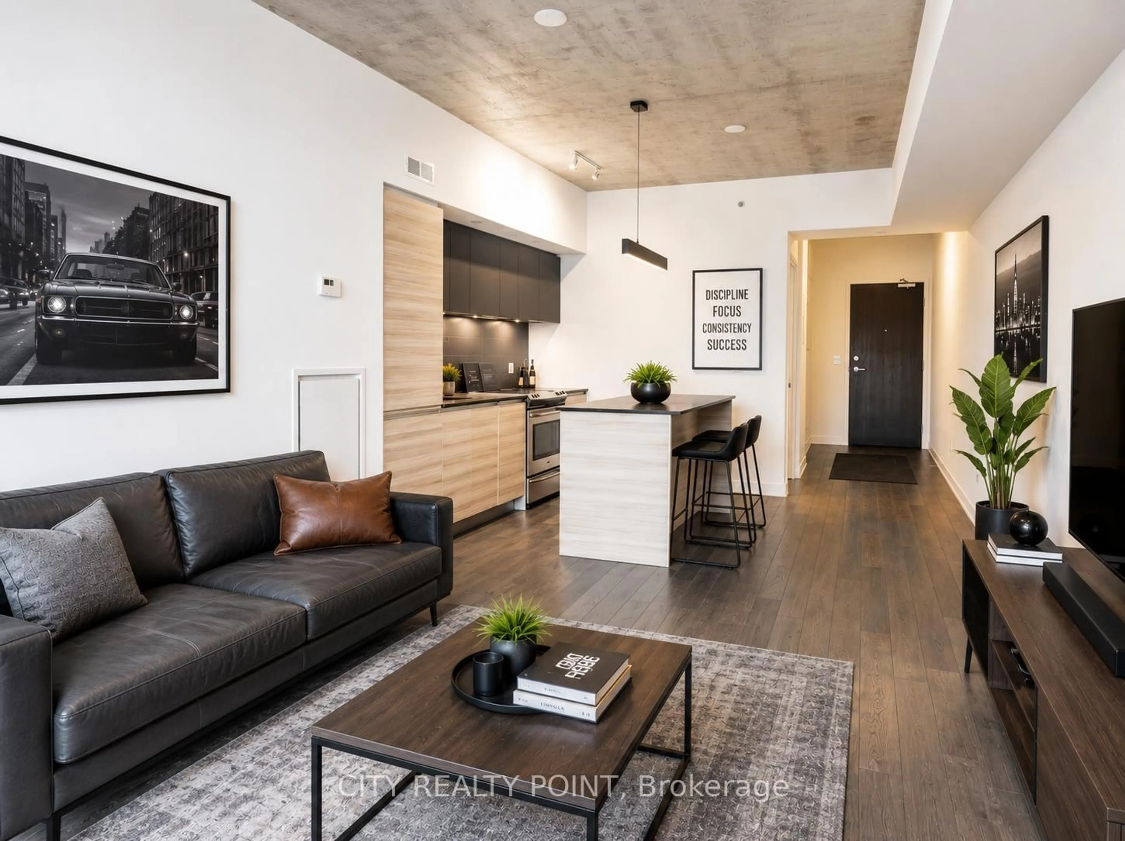 Living room with furniture, cement floor for 1190 Dundas St #505, Toronto Ontario M4M 0C5
