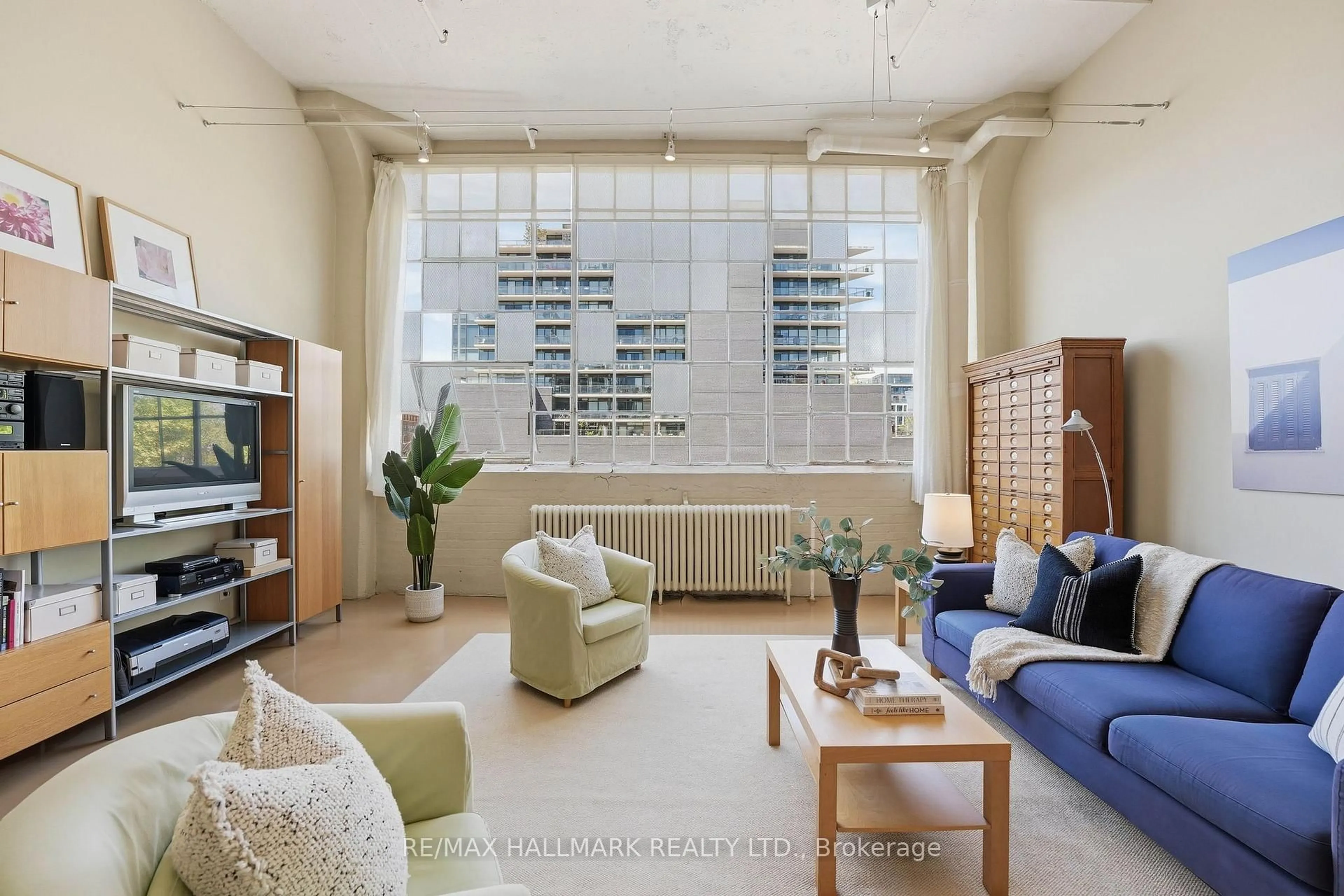 Living room with furniture, unknown for 245 Carlaw Ave #203, Toronto Ontario M4M 2S6