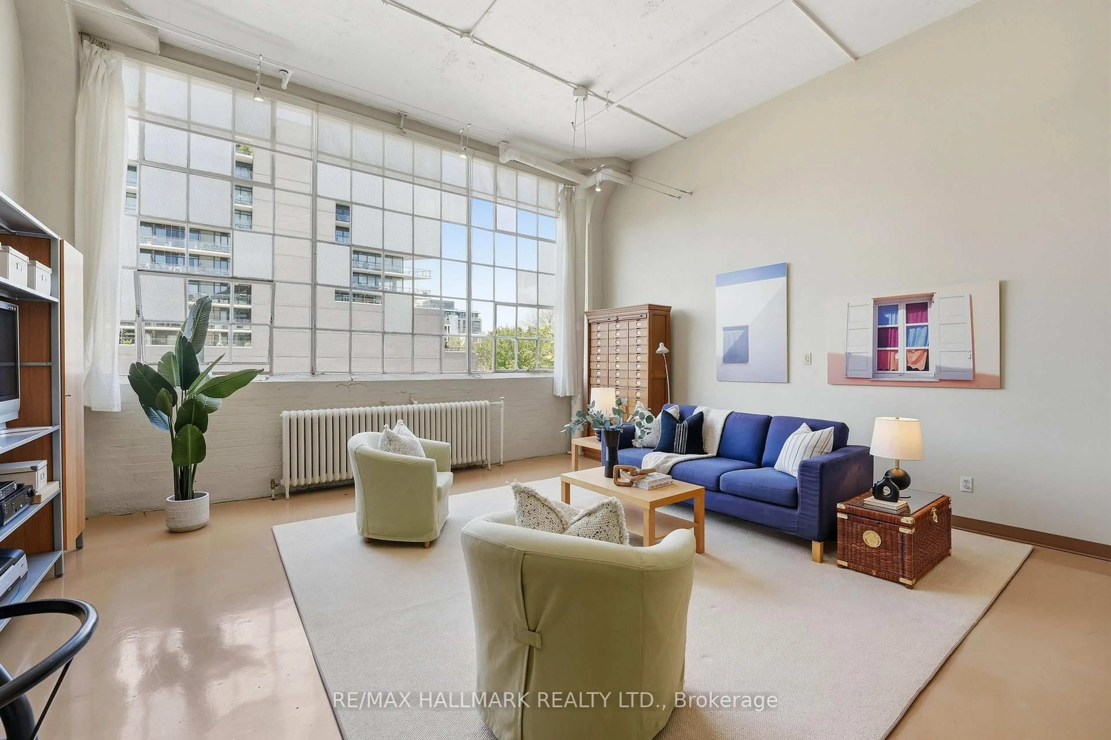Living room with furniture, unknown for 245 Carlaw Ave #203, Toronto Ontario M4M 2S6