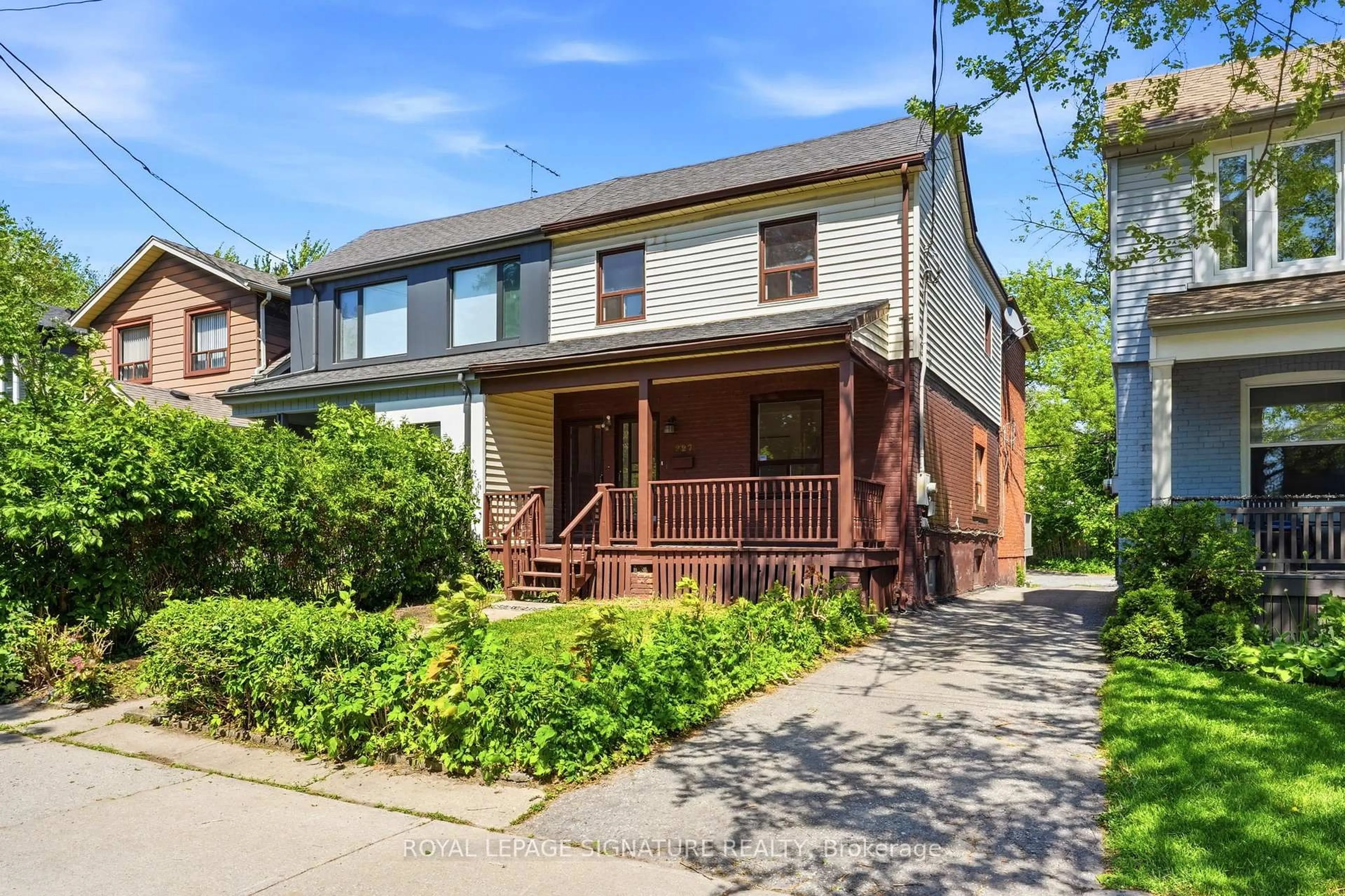 Home with brick exterior material, street for 227 Woodfield Rd, Toronto Ontario M4L 2W8