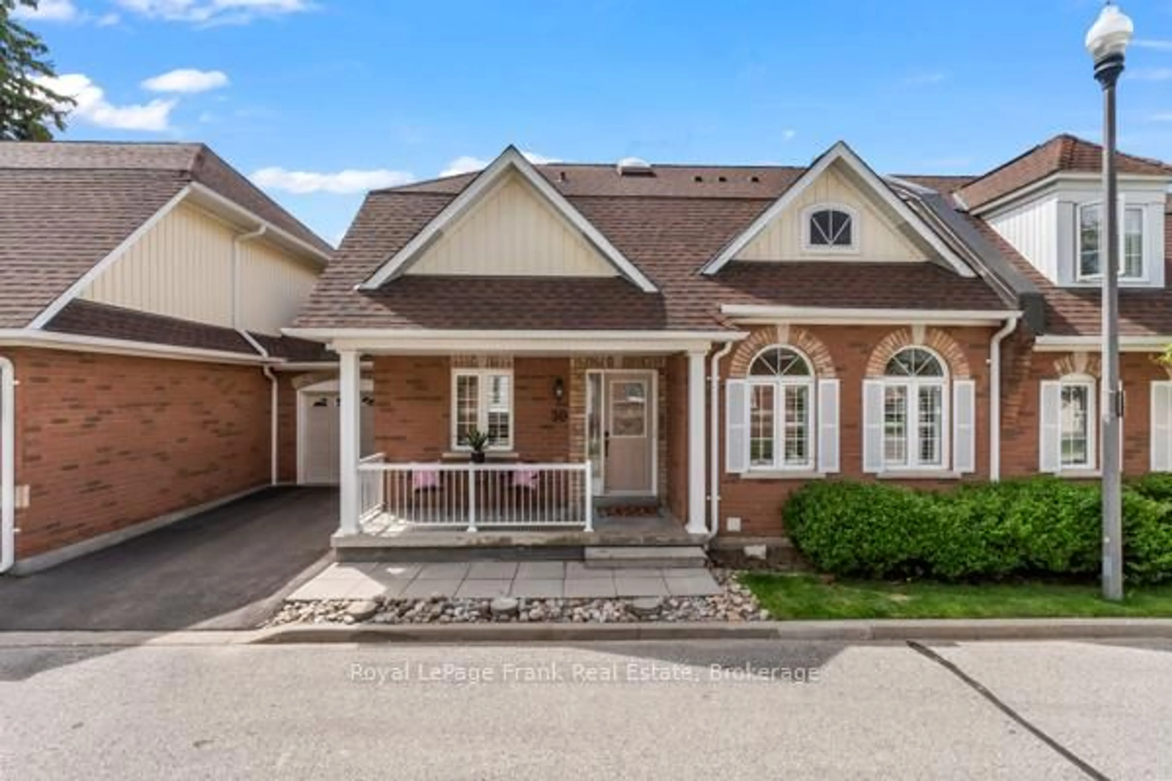 Home with brick exterior material, street for 30 Gidley Lane #30, Ajax Ontario L1T 4Z7