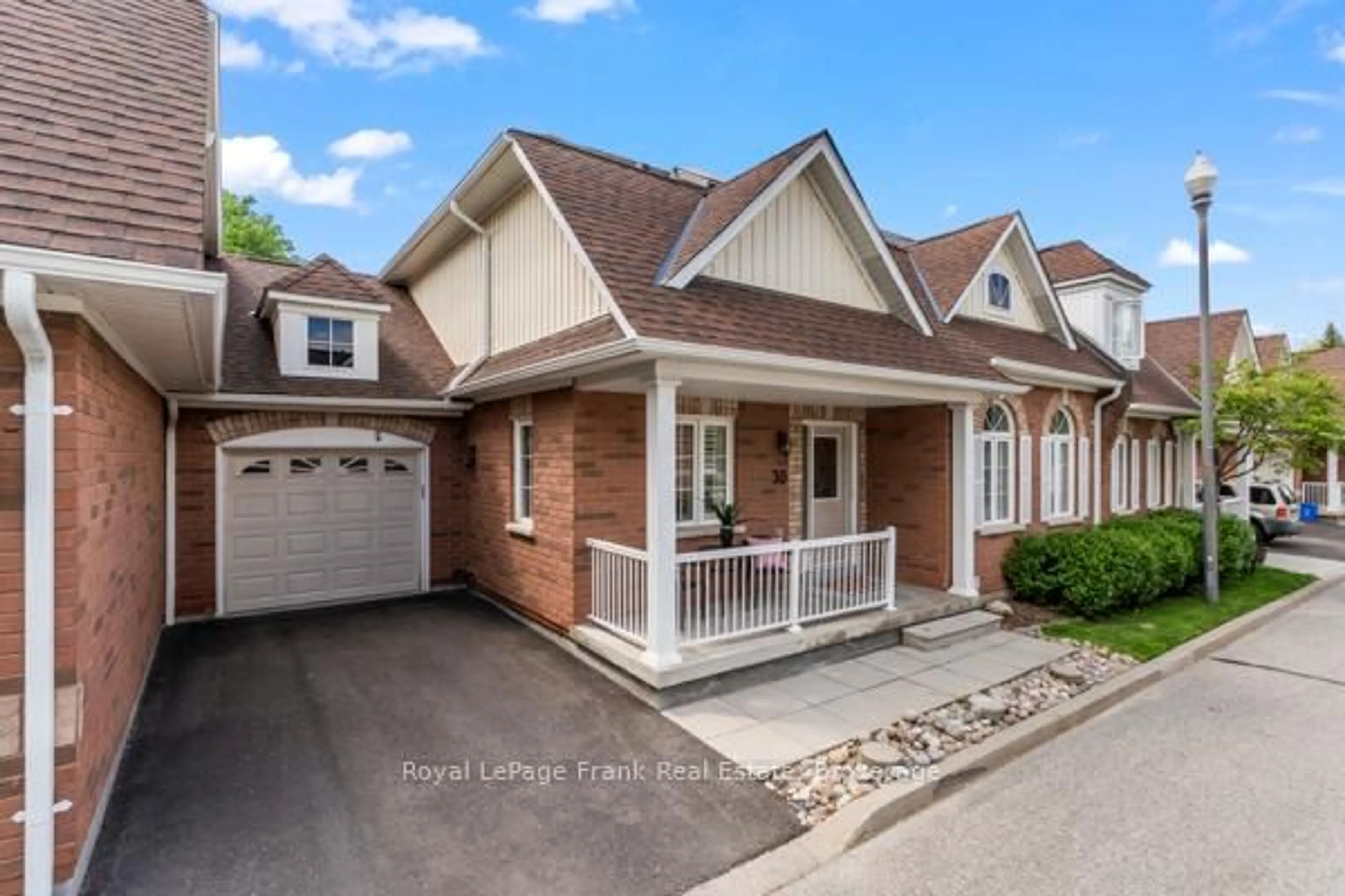 Home with brick exterior material, street for 30 Gidley Lane #30, Ajax Ontario L1T 4Z7