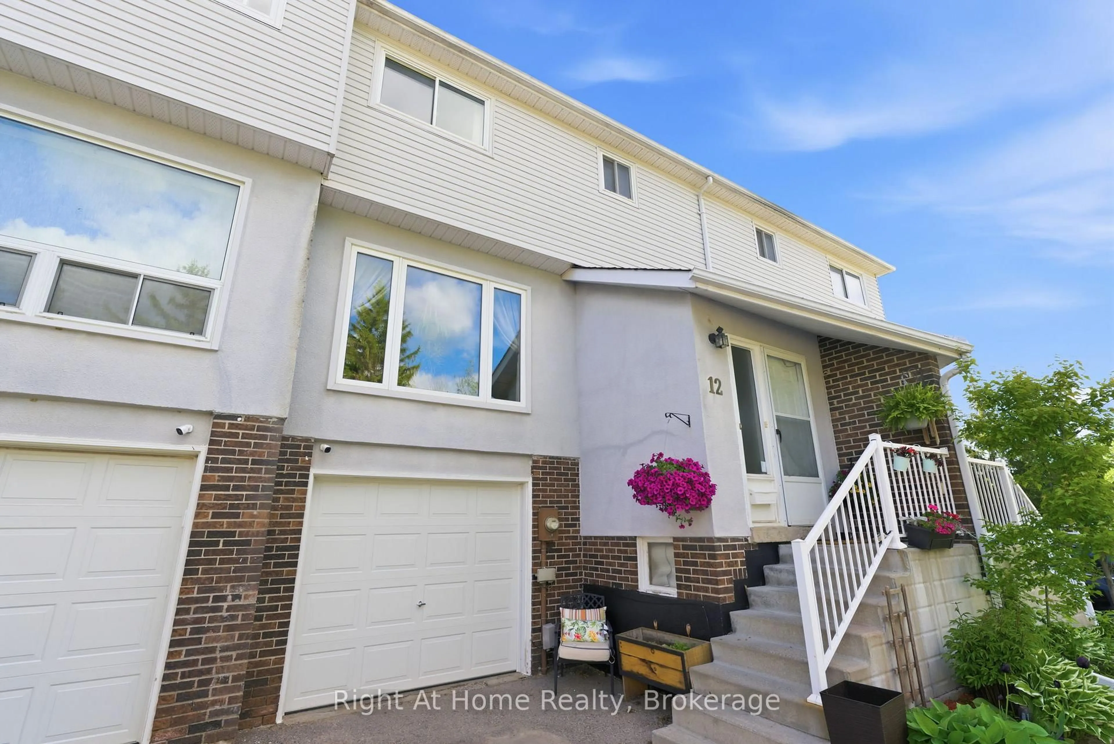 Home with vinyl exterior material, street for 303 Garden St #12, Whitby Ontario L1N 3W3