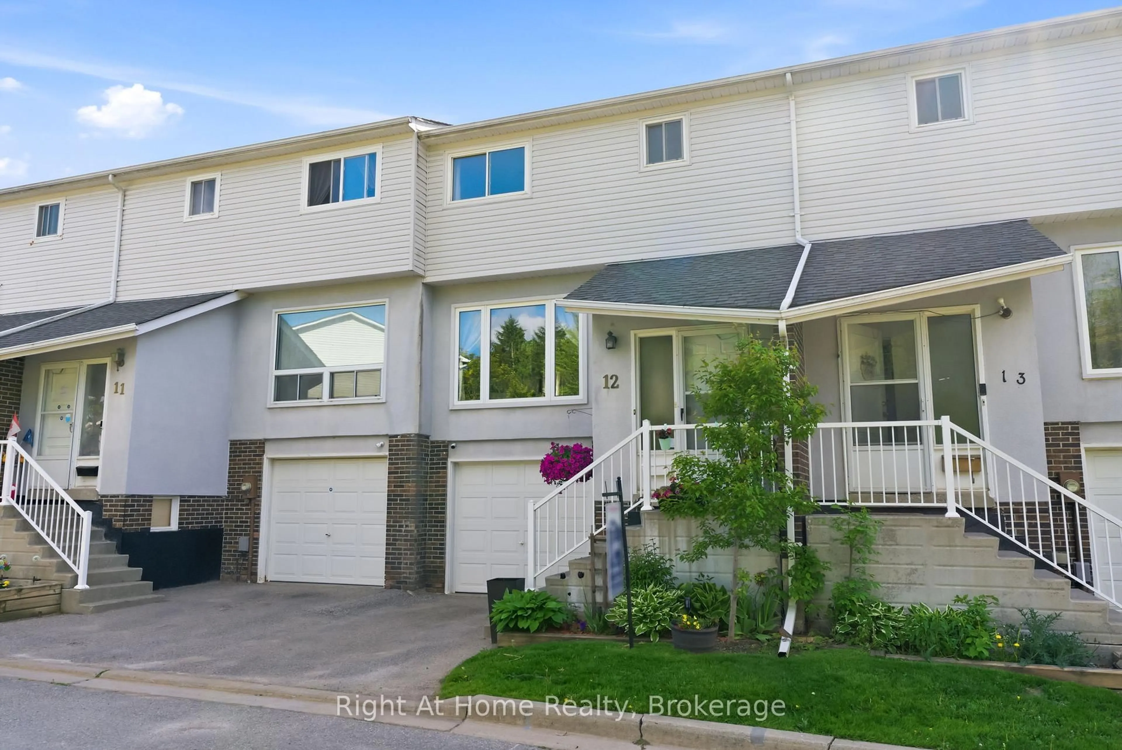 Home with vinyl exterior material, street for 303 Garden St #12, Whitby Ontario L1N 3W3
