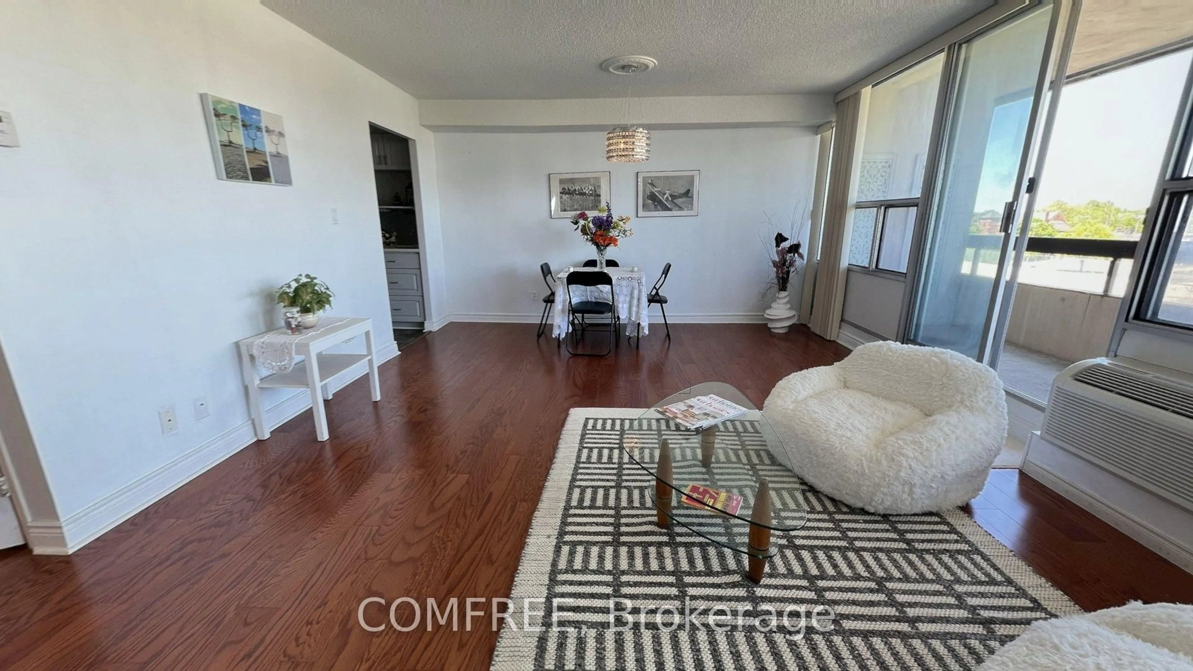 Living room with furniture, wood/laminate floor for 55 William St #505, Oshawa Ontario L1G 7C9