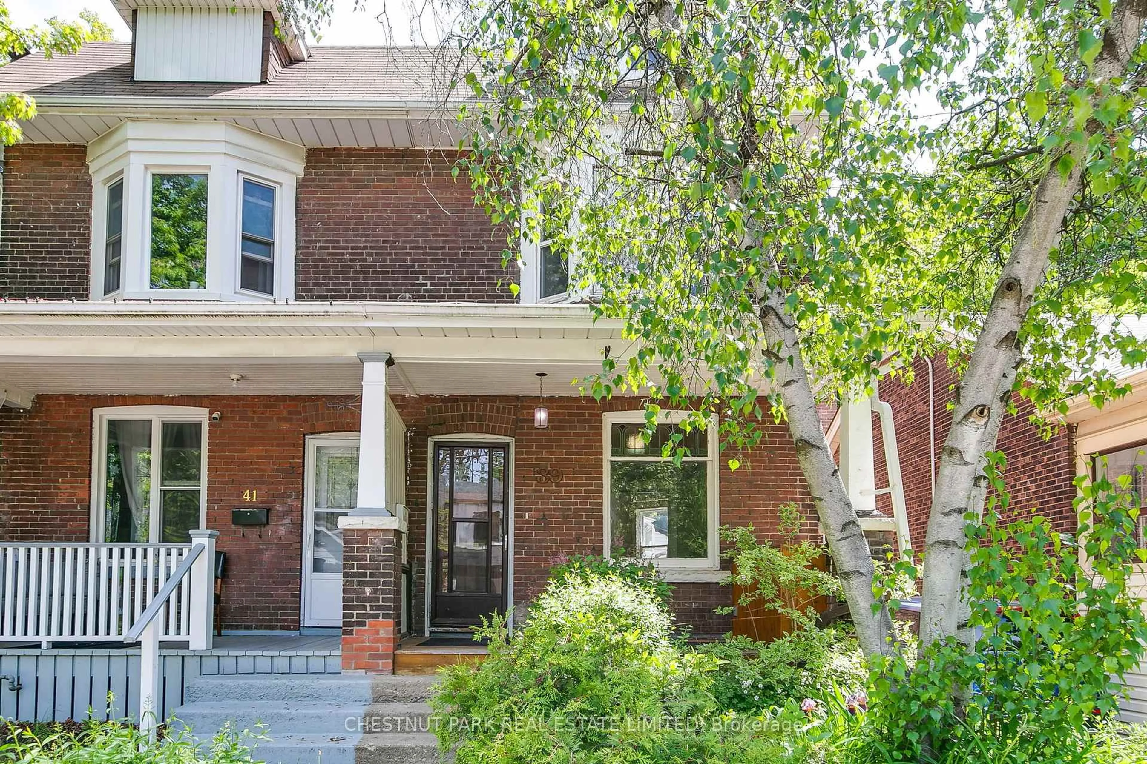 Home with brick exterior material, street for 39 Devon Rd, Toronto Ontario M4E 2J7
