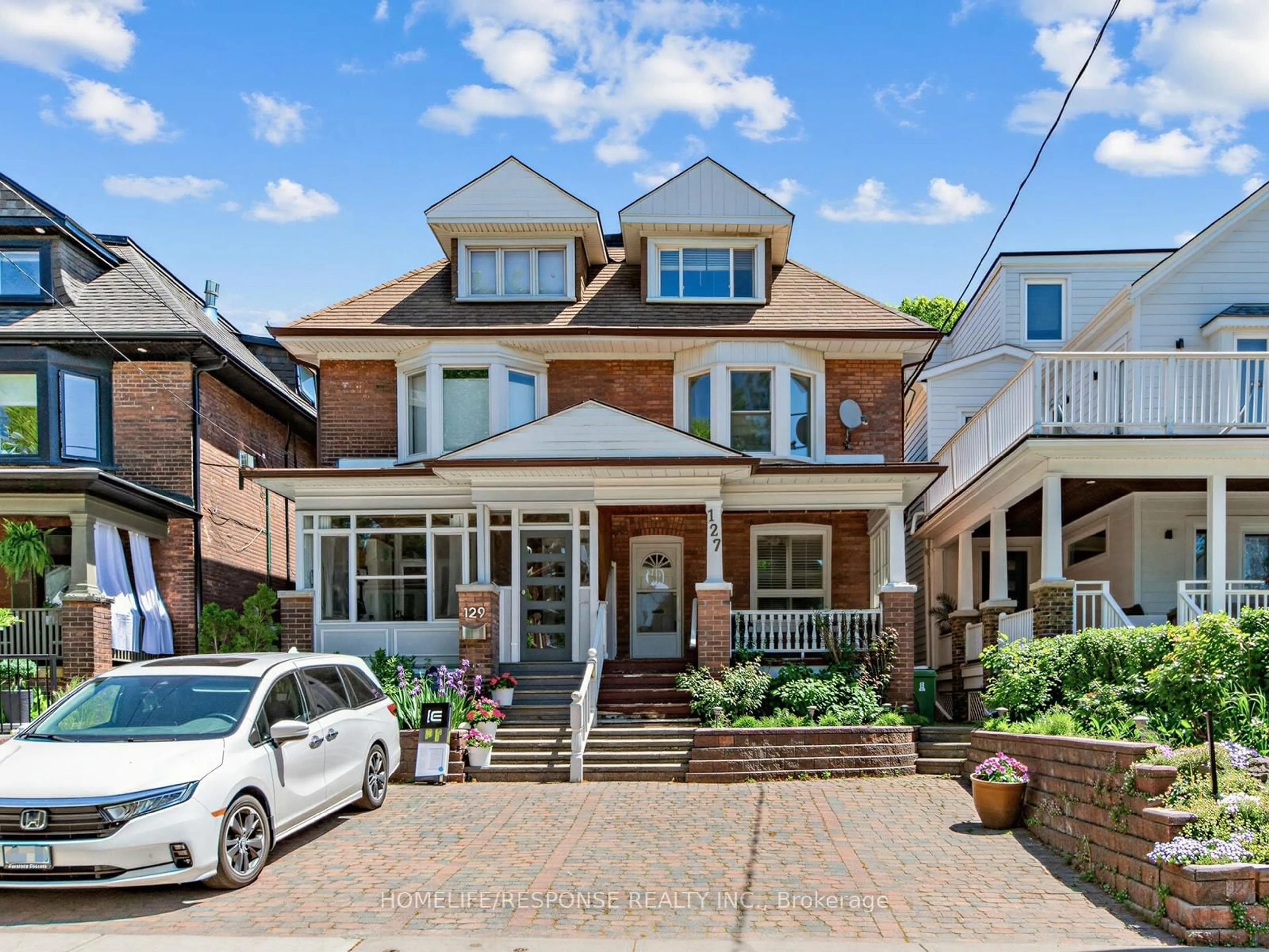 Home with brick exterior material, street for 127 Lee Ave, Toronto Ontario M4E 2P2