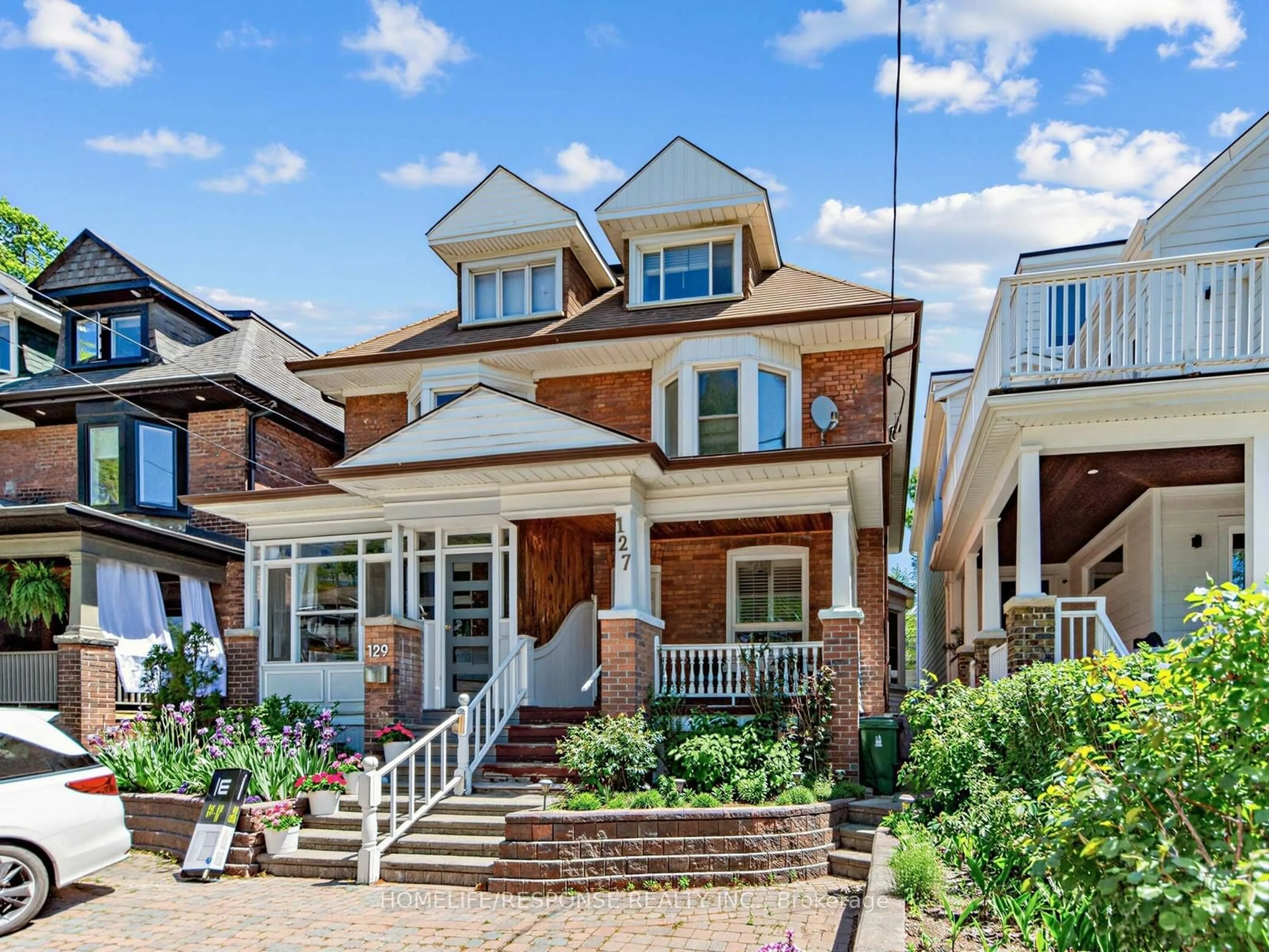 Home with brick exterior material, street for 127 Lee Ave, Toronto Ontario M4E 2P2