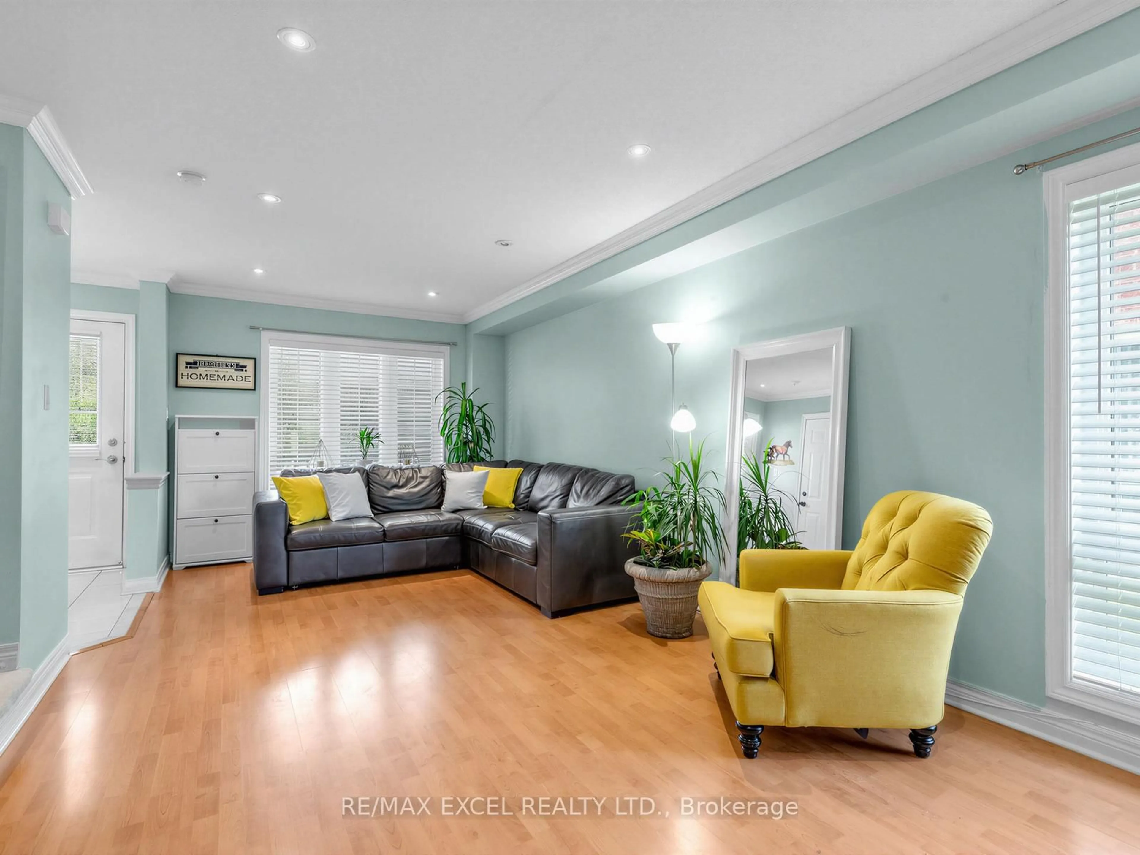 Living room with furniture, wood/laminate floor for 764 Craighurst Crt, Pickering Ontario L1X 2W9