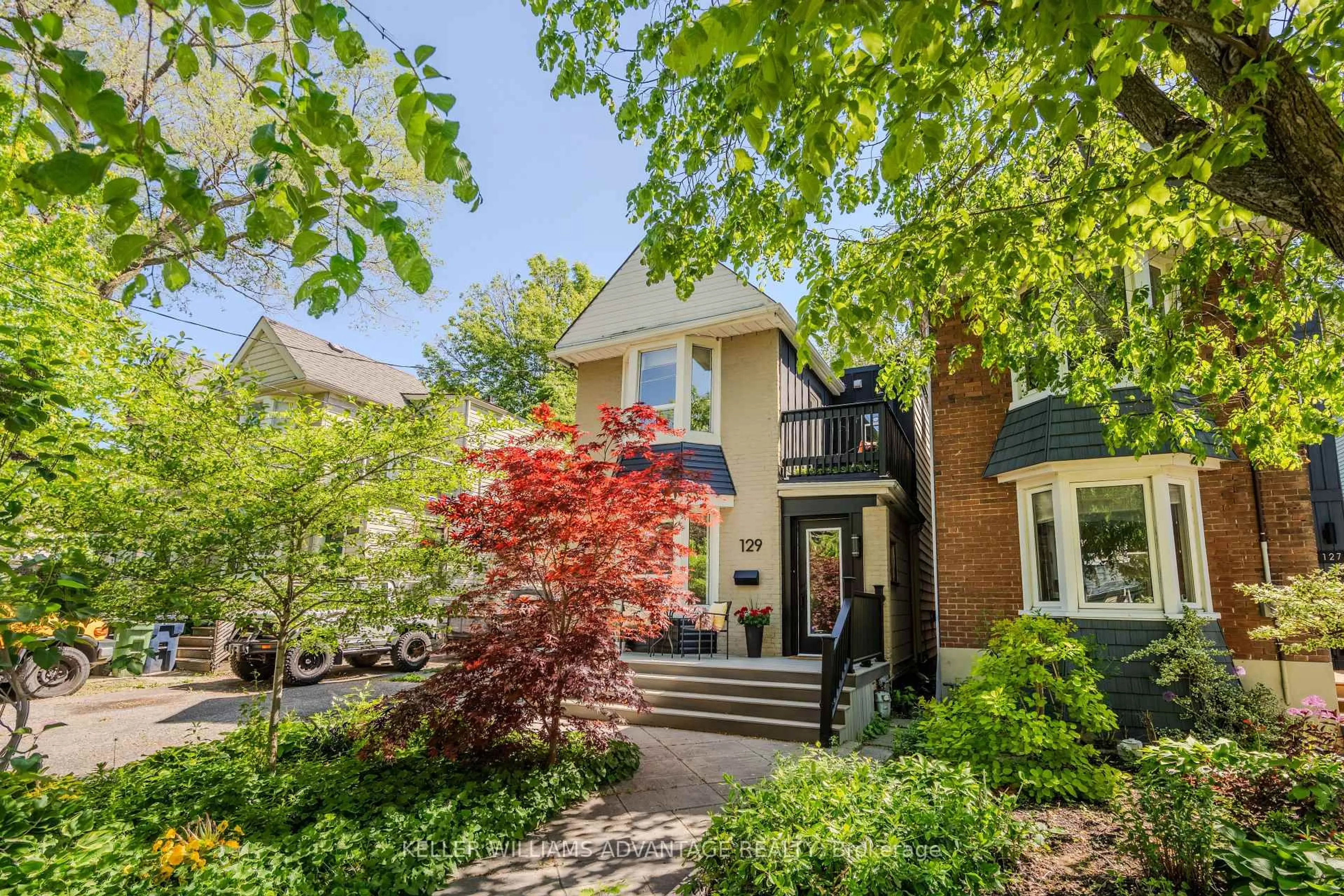 Home with brick exterior material, street for 129 Woodfield Rd, Toronto Ontario M4L 2W5