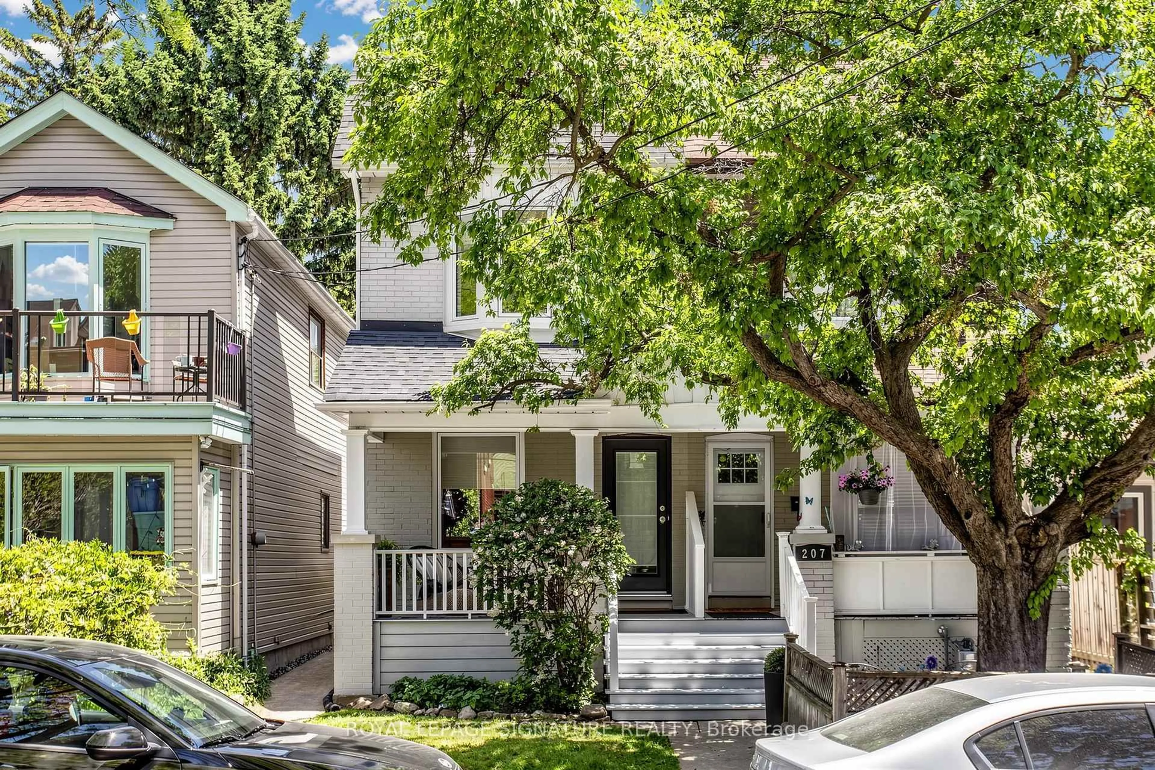 Home with vinyl exterior material, street for 209 Rhodes Ave, Toronto Ontario M4L 3A2