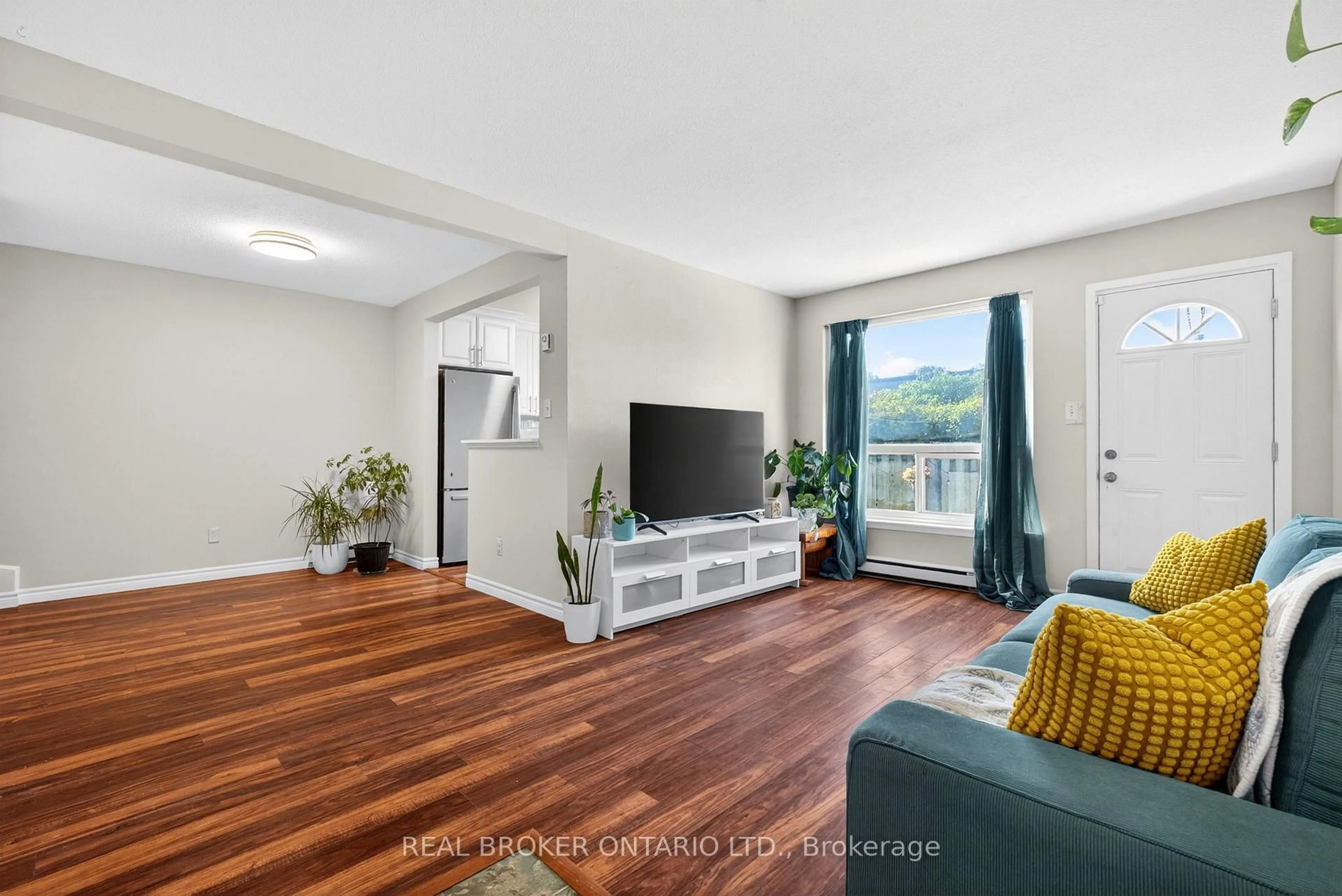Living room with furniture, wood/laminate floor for 401 Wentworth St #53, Oshawa Ontario L1J 6J1