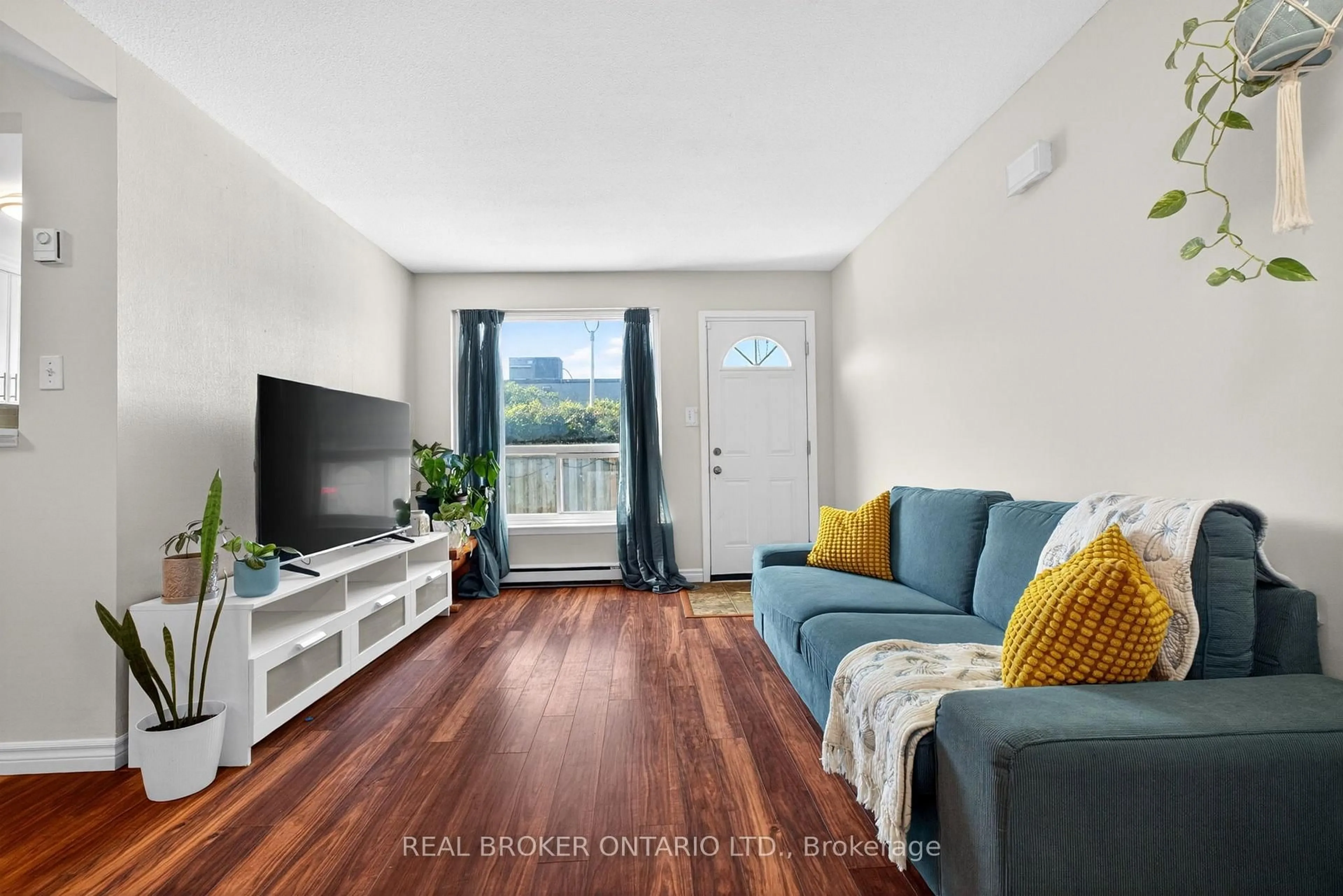 Living room with furniture, wood/laminate floor for 401 Wentworth St #53, Oshawa Ontario L1J 6J1