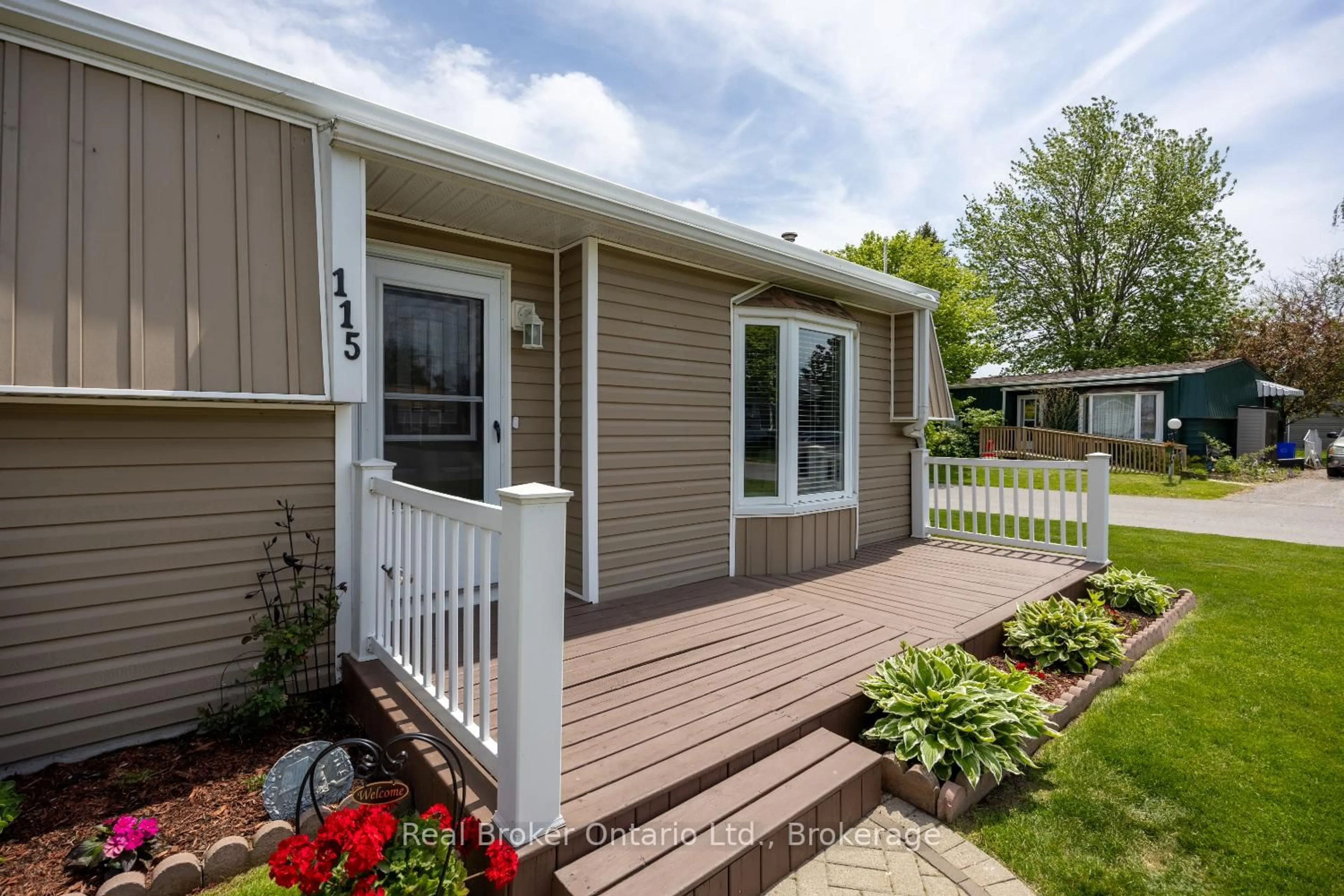 Home with vinyl exterior material, street for 115 Wilmot Tr, Clarington Ontario L1B 1A8