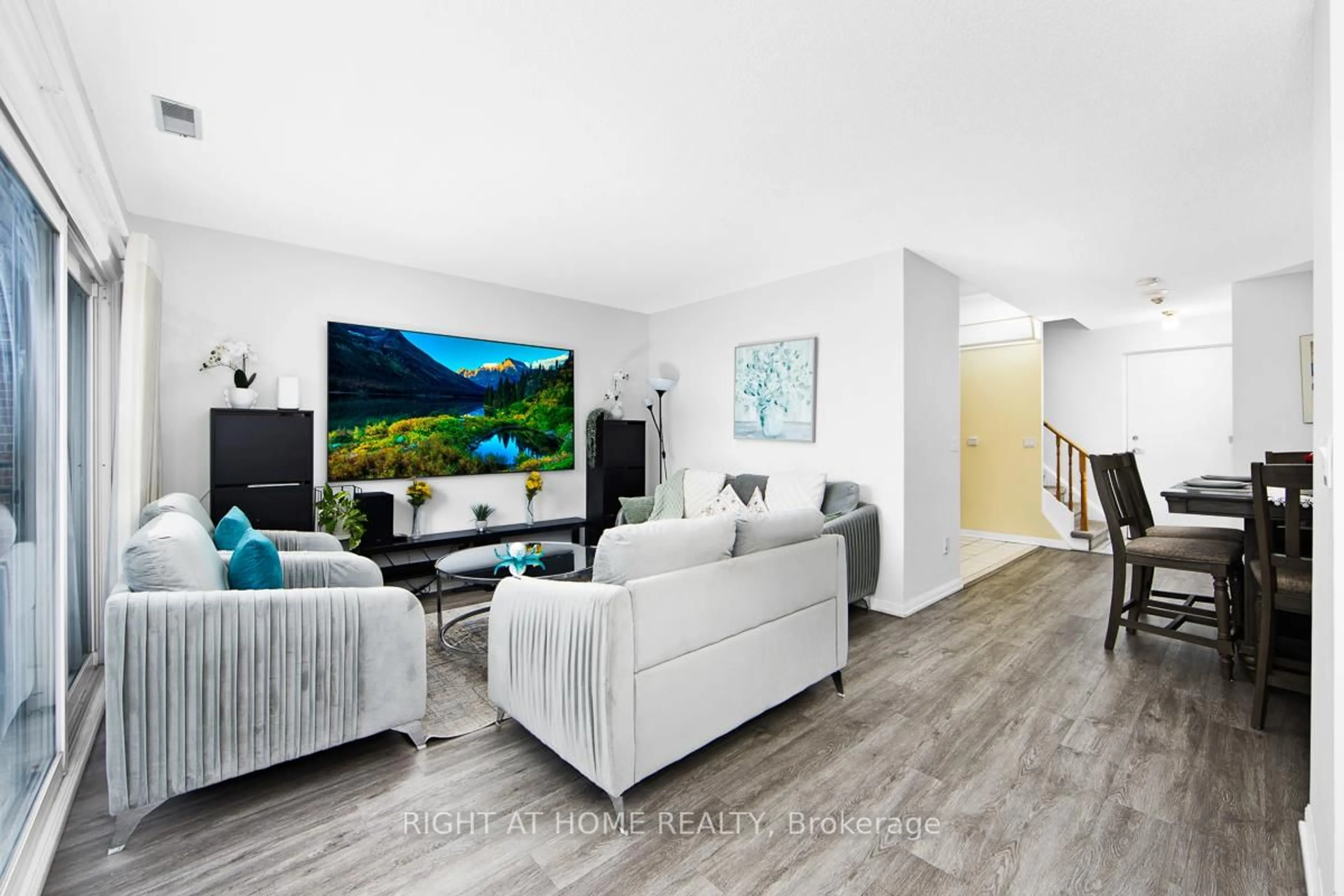 Living room with furniture, wood/laminate floor for 1400 The Esplanade #702, Pickering Ontario L1V 6V2