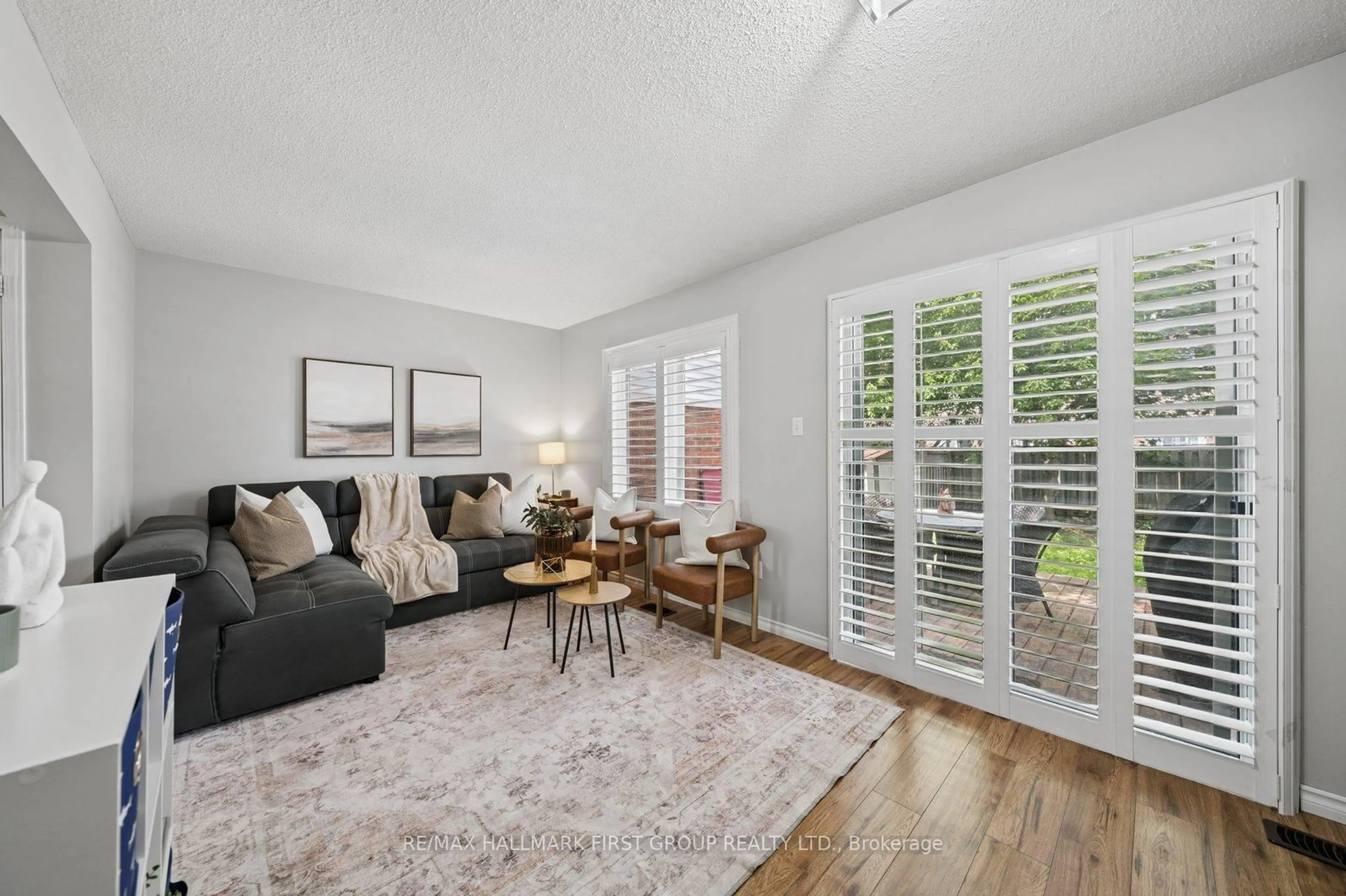 Living room with furniture, wood/laminate floor for 95 Vail Meadows Cres, Clarington Ontario L1C 4T3