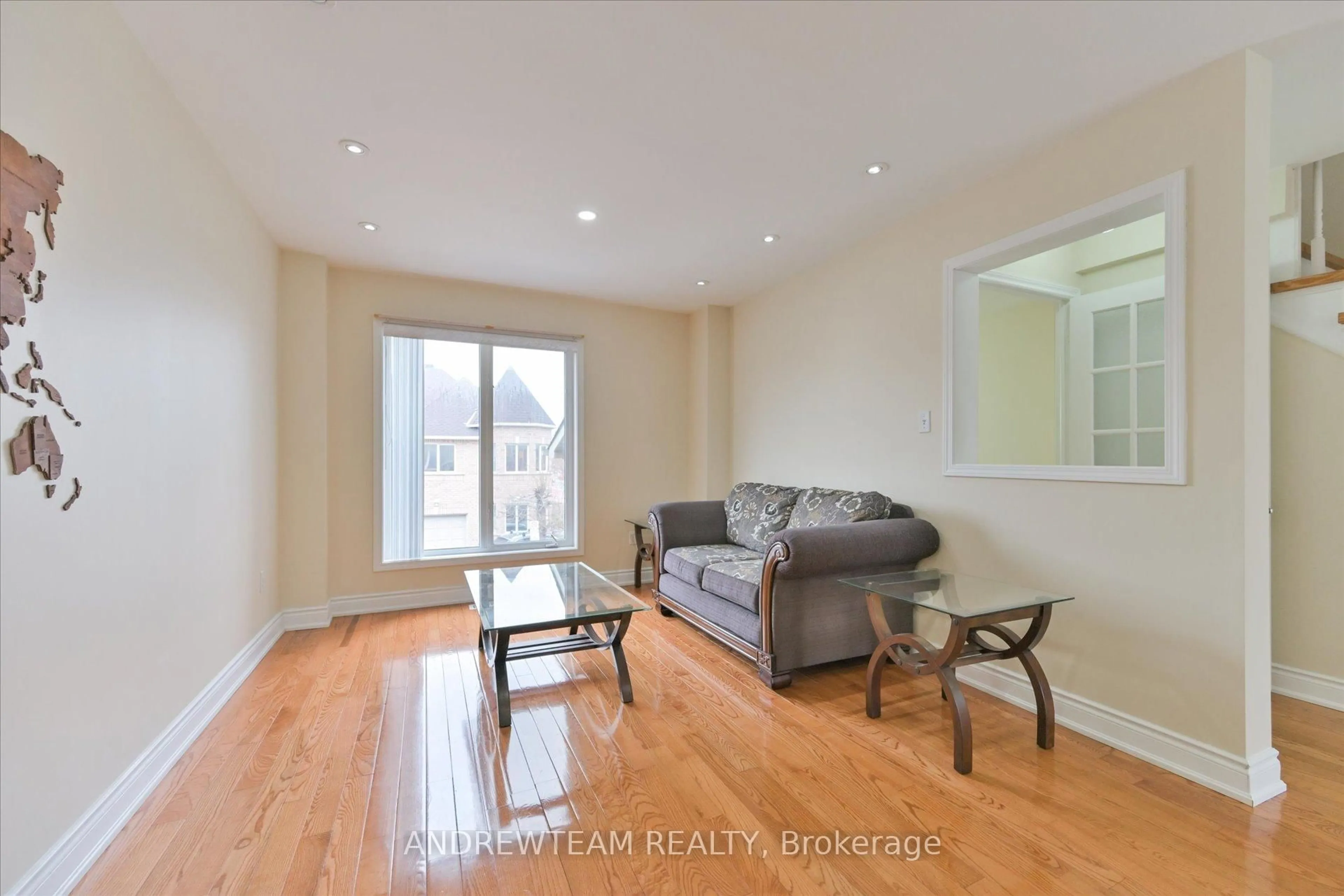 Living room with furniture, wood/laminate floor for 1075 Ellesmere Rd #1, Toronto Ontario M1P 5C3
