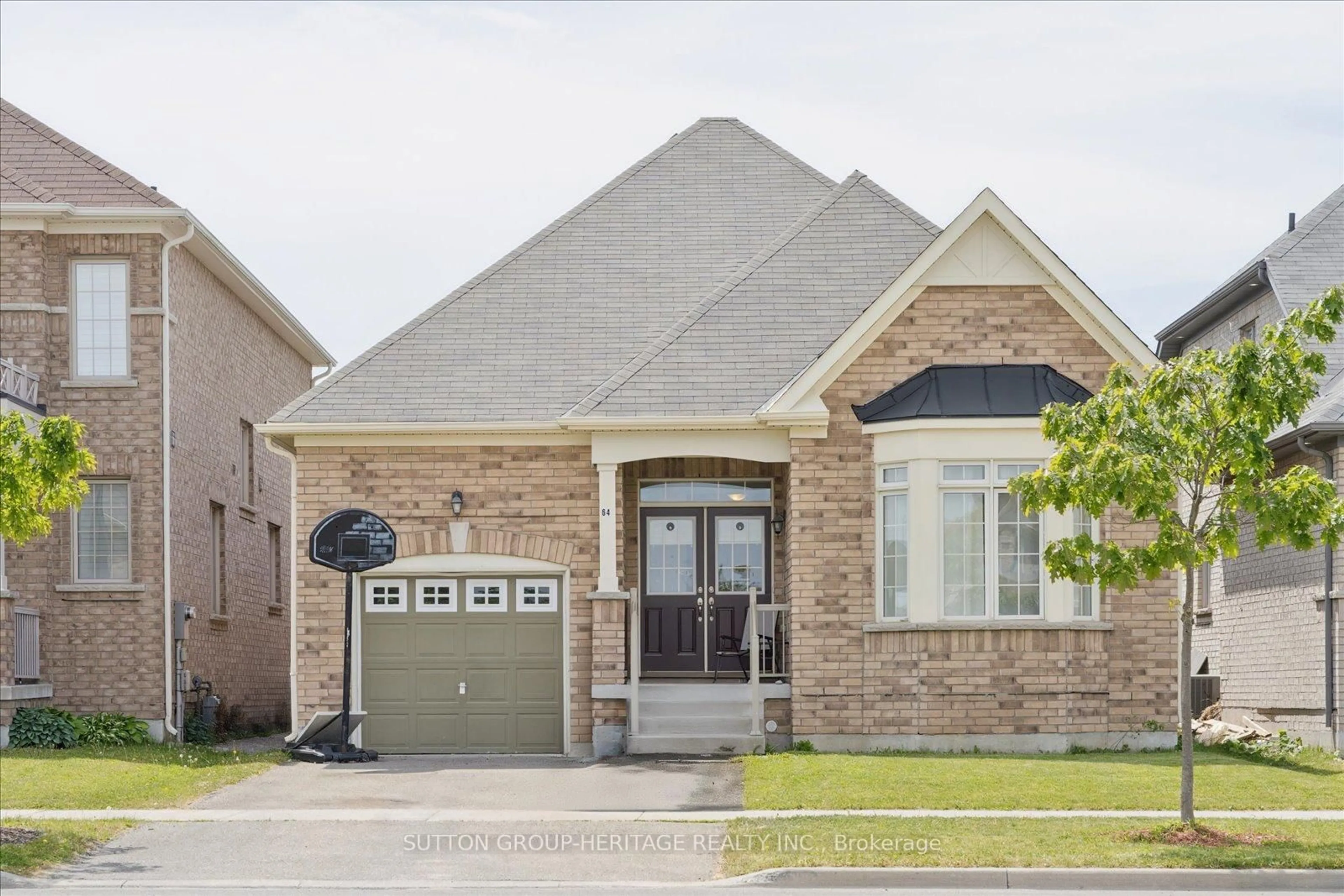 Home with brick exterior material, street for 64 Pedwell St, Clarington Ontario L1B 0E1