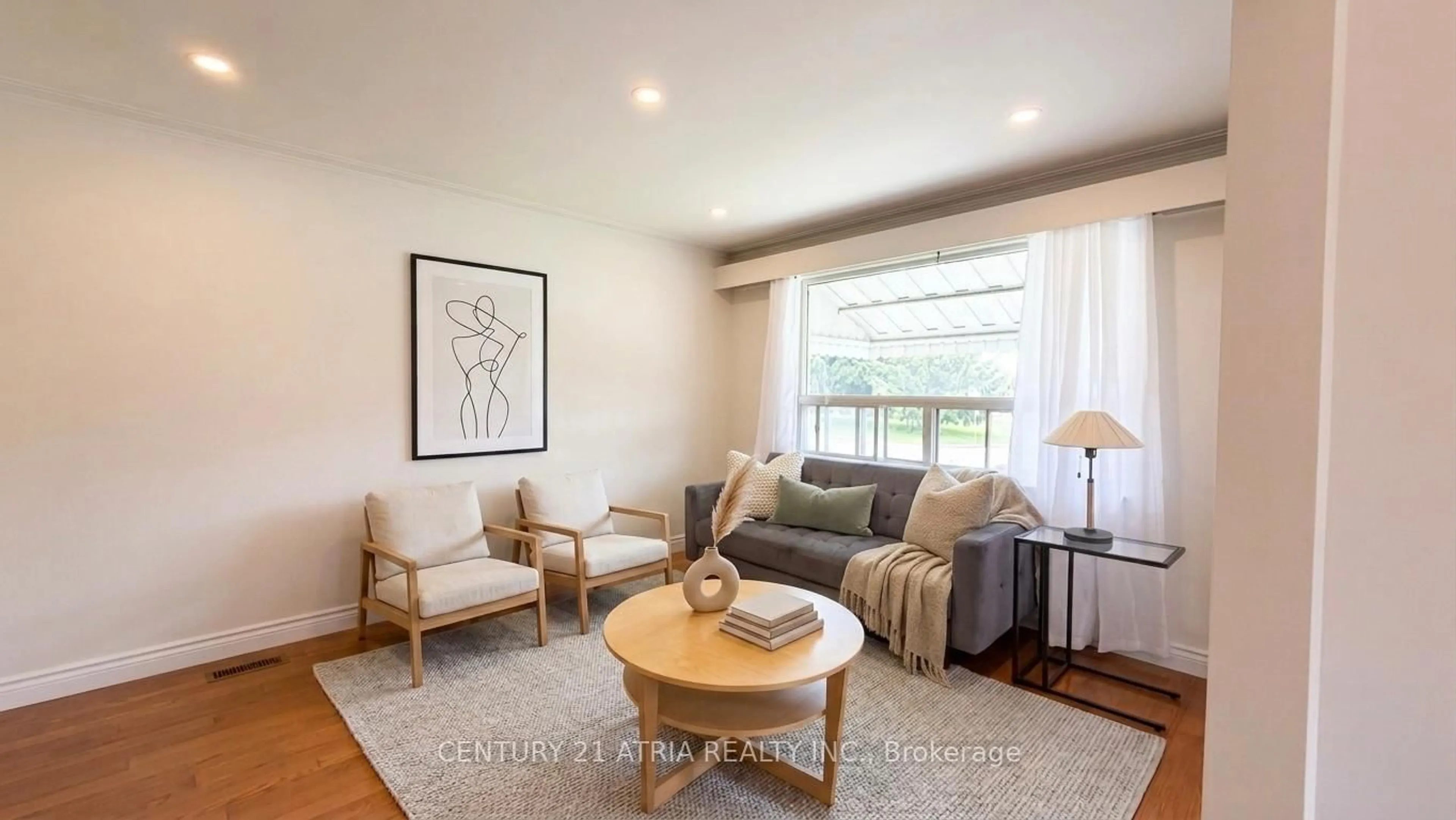 Living room with furniture, wood/laminate floor for 115 Ellington Dr, Toronto Ontario M1R 3Y2