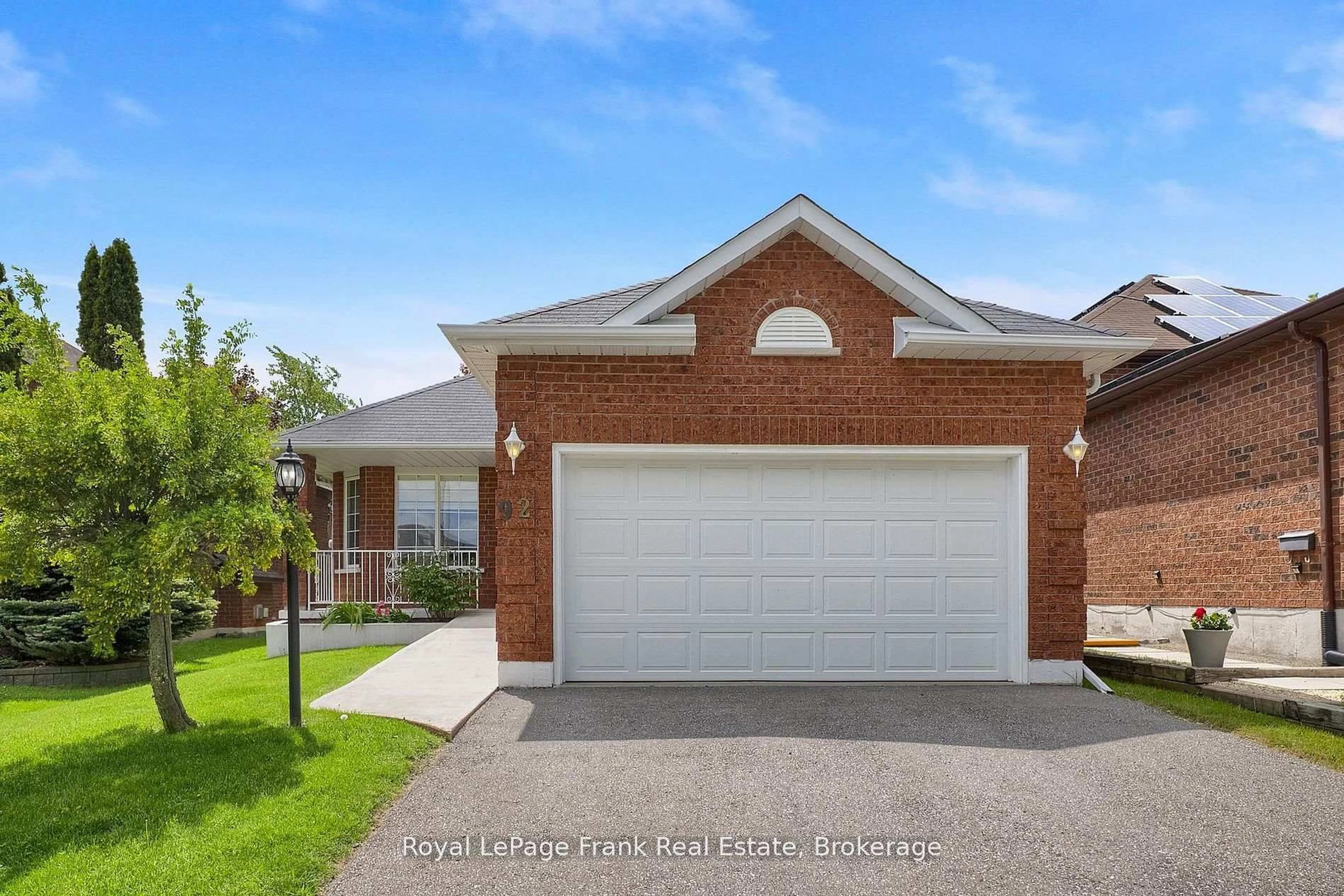 Home with brick exterior material, street for 92 West Side Dr, Clarington Ontario L1C 4Y9