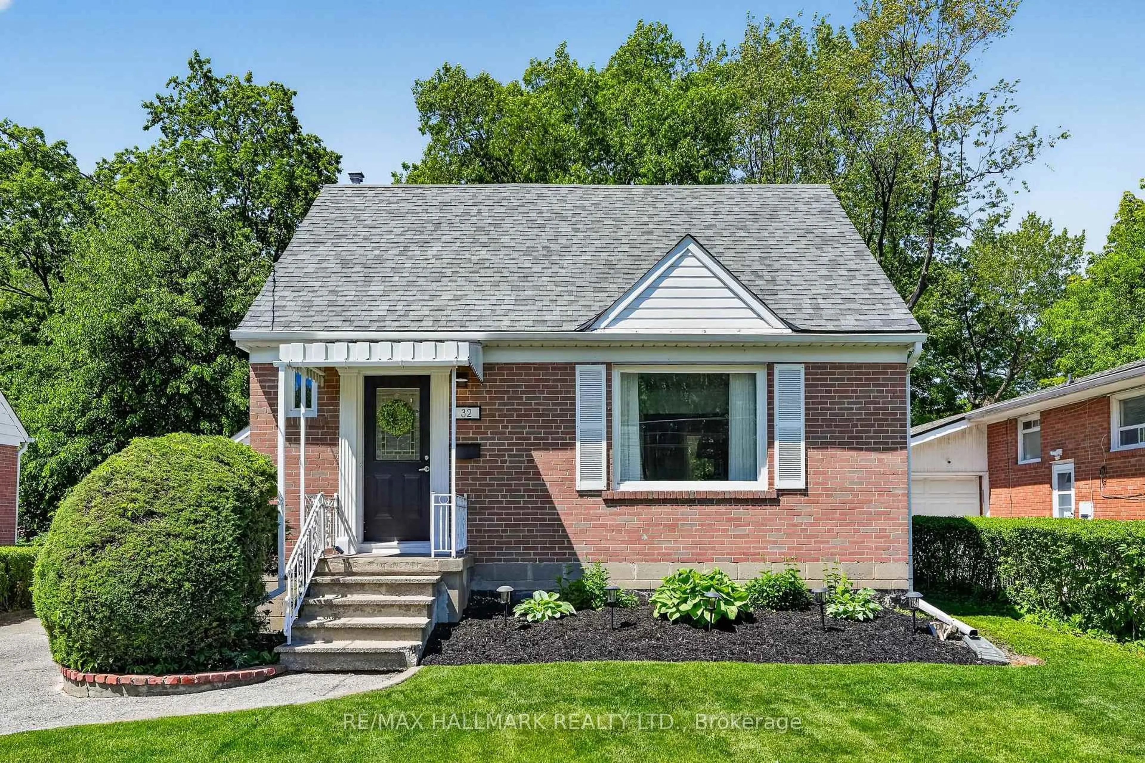 Home with brick exterior material, street for 32 Rockwood Dr, Toronto Ontario M1M 3N1
