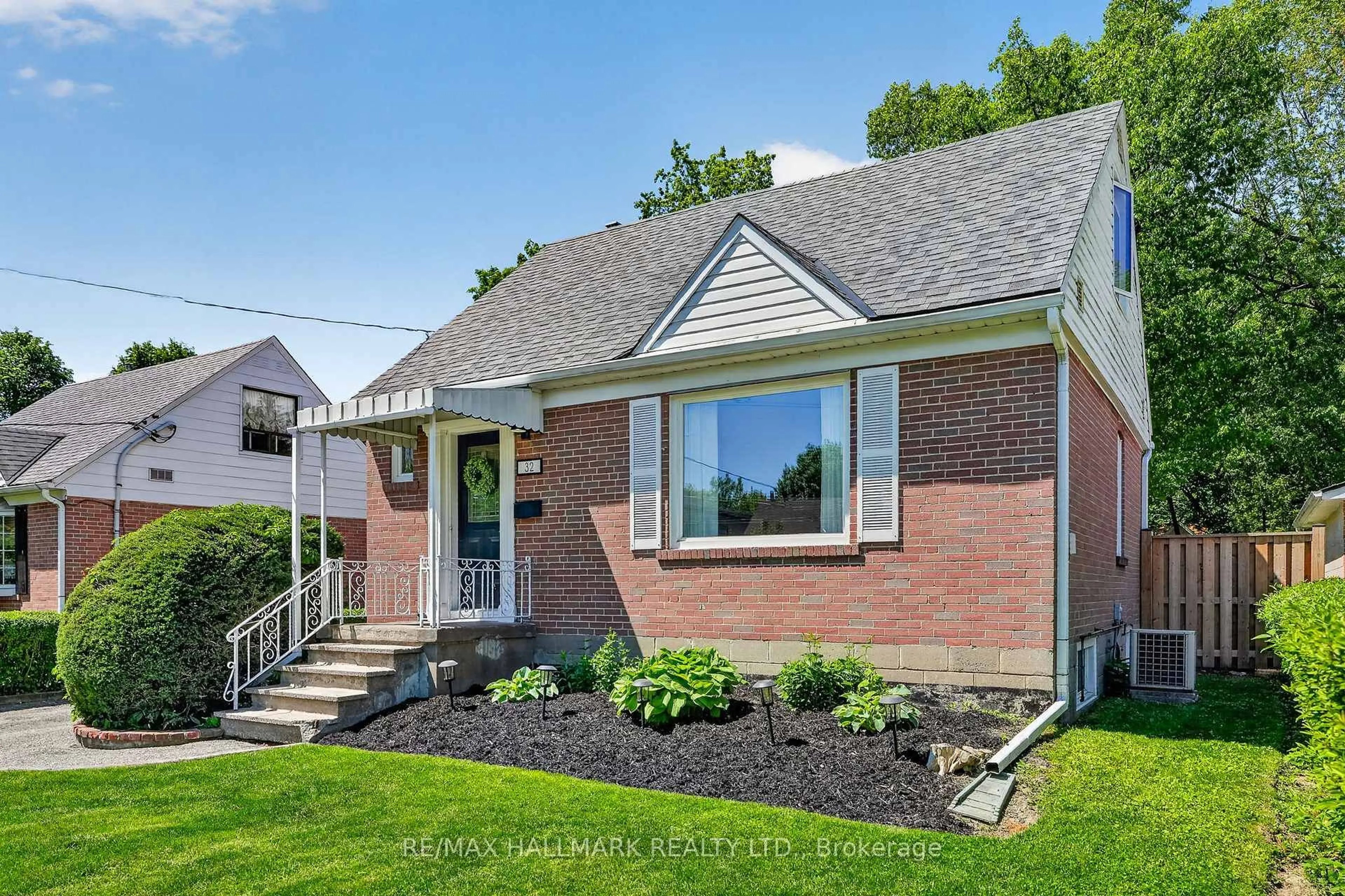 Home with brick exterior material, street for 32 Rockwood Dr, Toronto Ontario M1M 3N1