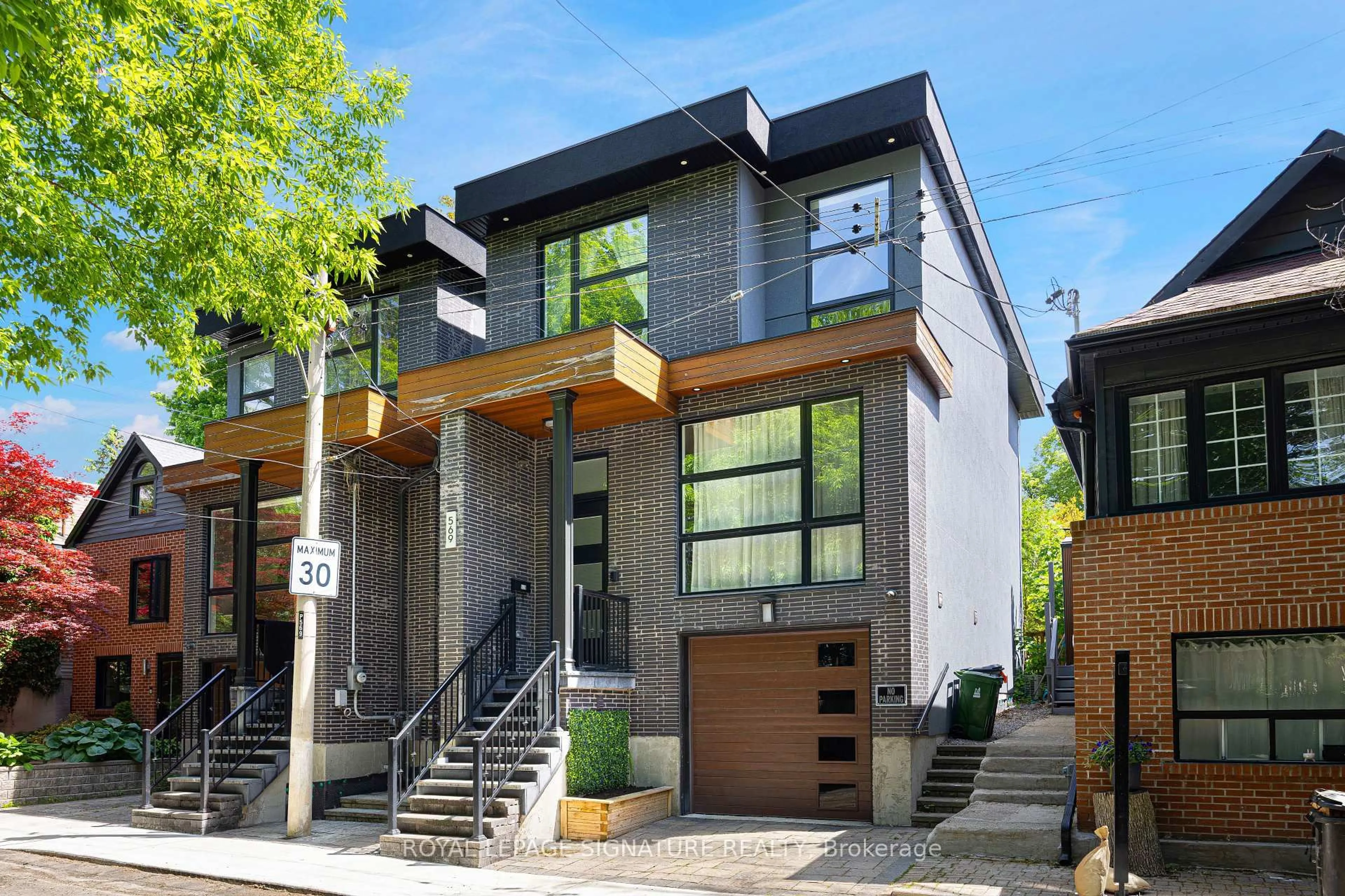 Home with brick exterior material, street for 569 Craven Rd, Toronto Ontario M4L 2Z6
