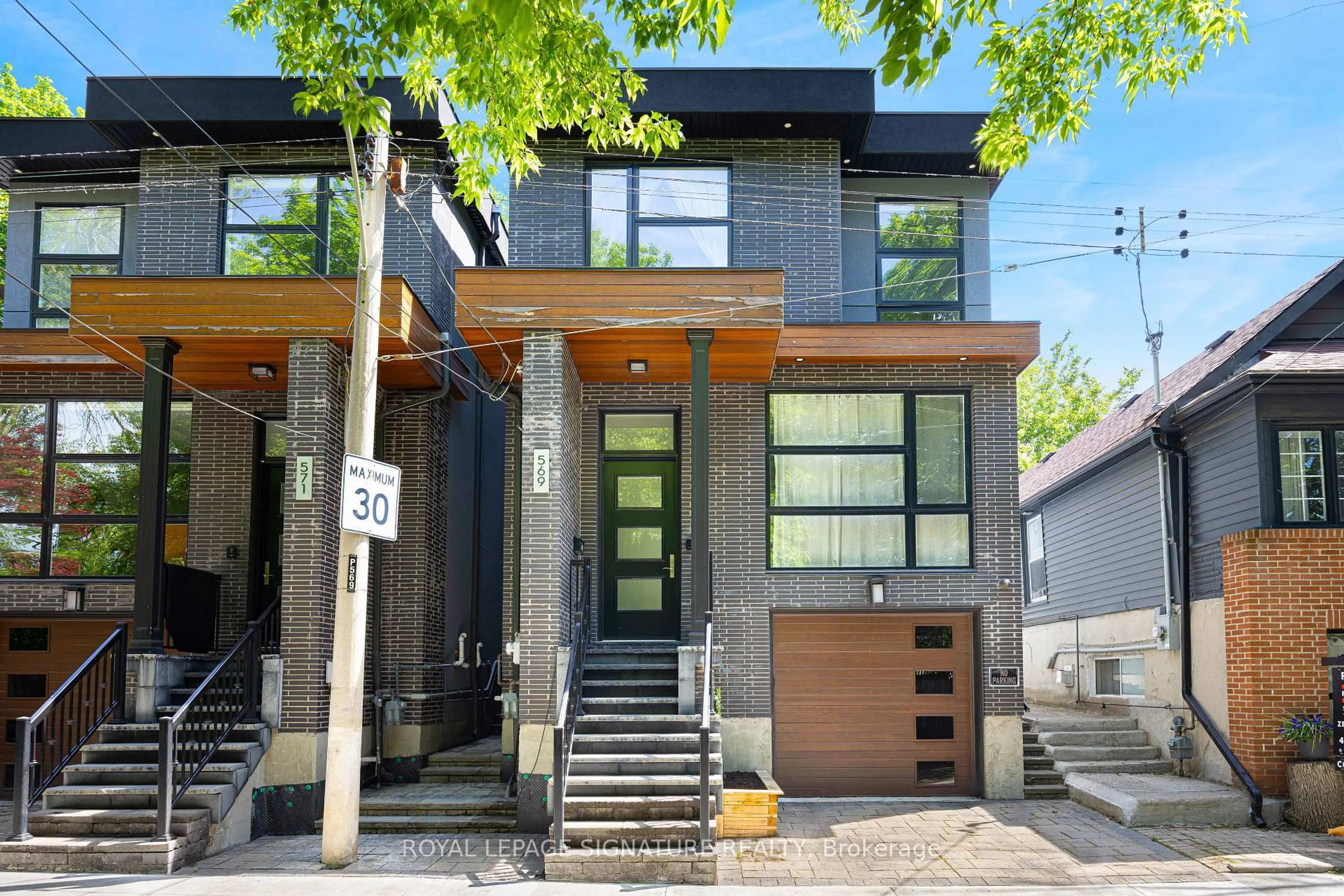 Home with brick exterior material, street for 569 Craven Rd, Toronto Ontario M4L 2Z6