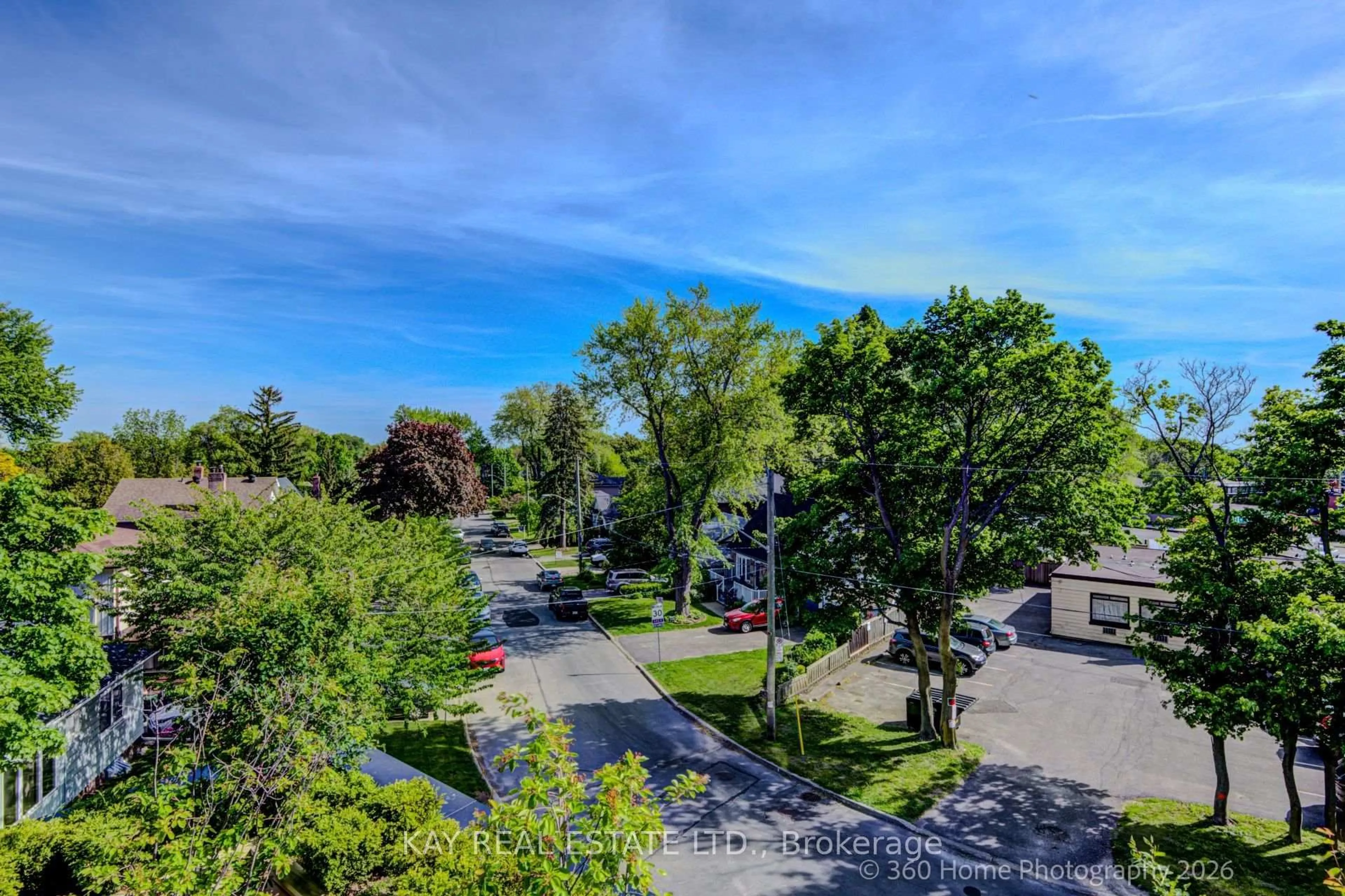 A pic from outside/outdoor area/front of a property/back of a property/a pic from drone, street for 2799 Kingston Rd #305, Toronto Ontario M1M 1N1