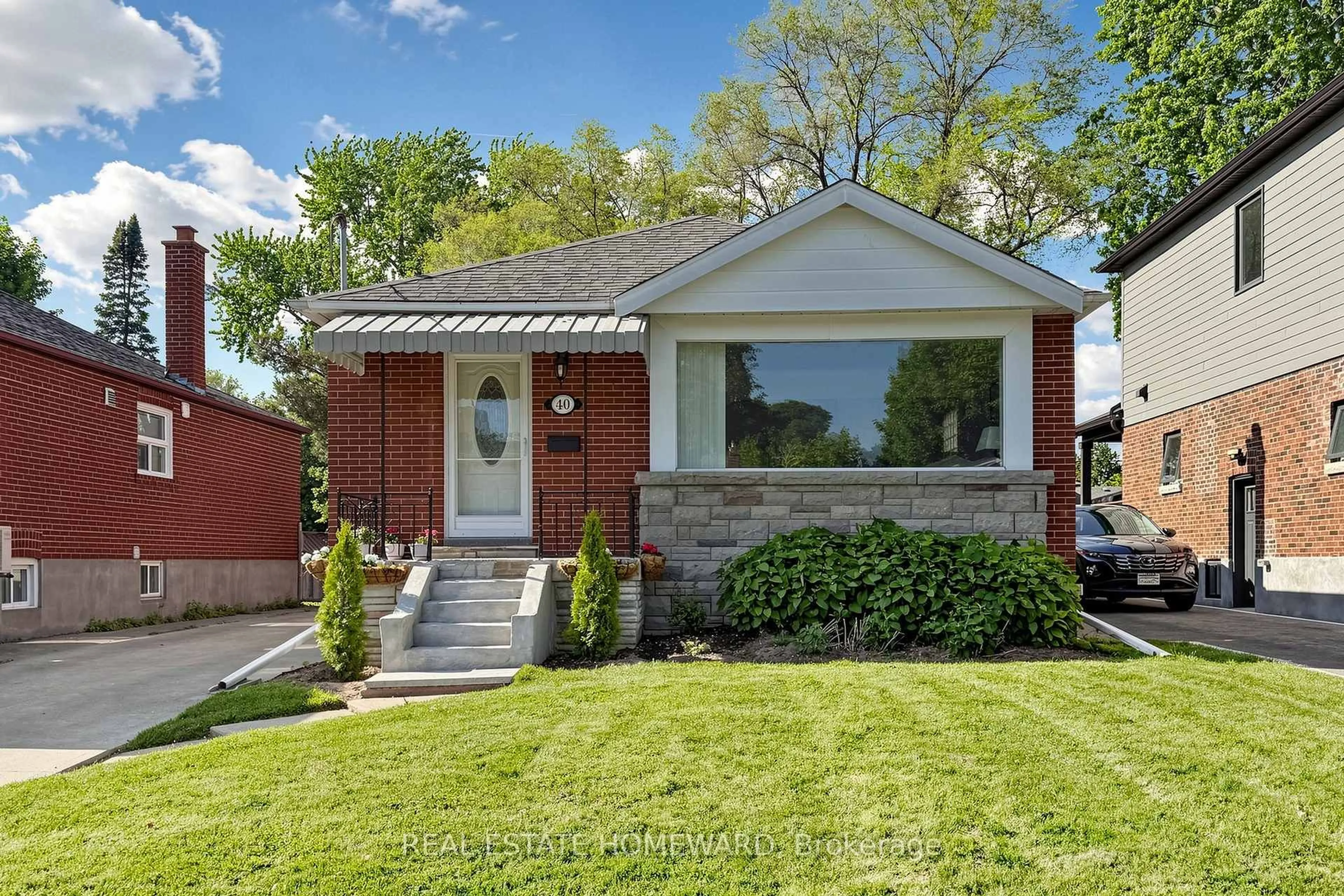 Home with brick exterior material, street for 40 Donora Dr, Toronto Ontario M4B 1B5
