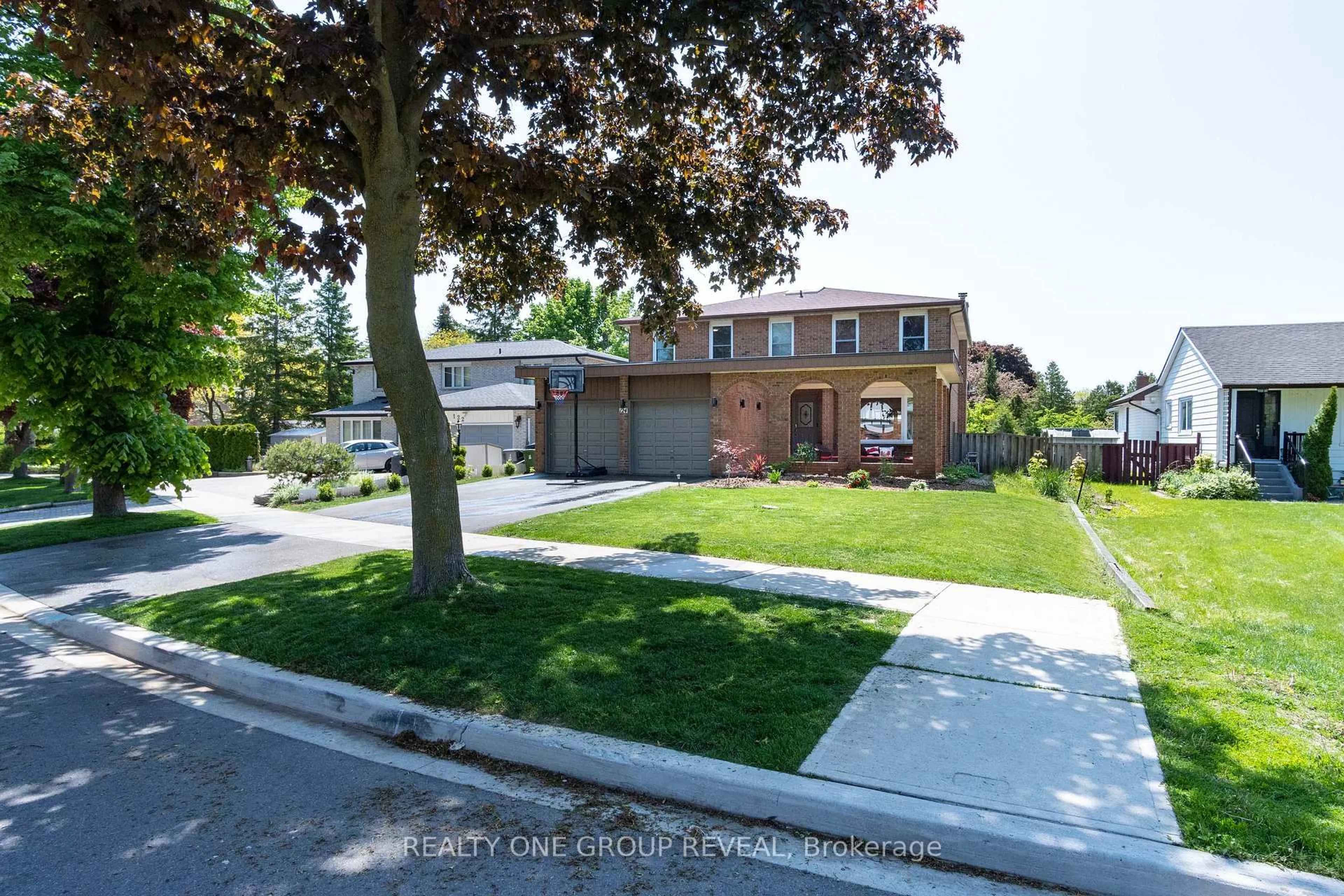 Home with brick exterior material, street for 124 Bathgate Dr, Toronto Ontario M1C 1T5
