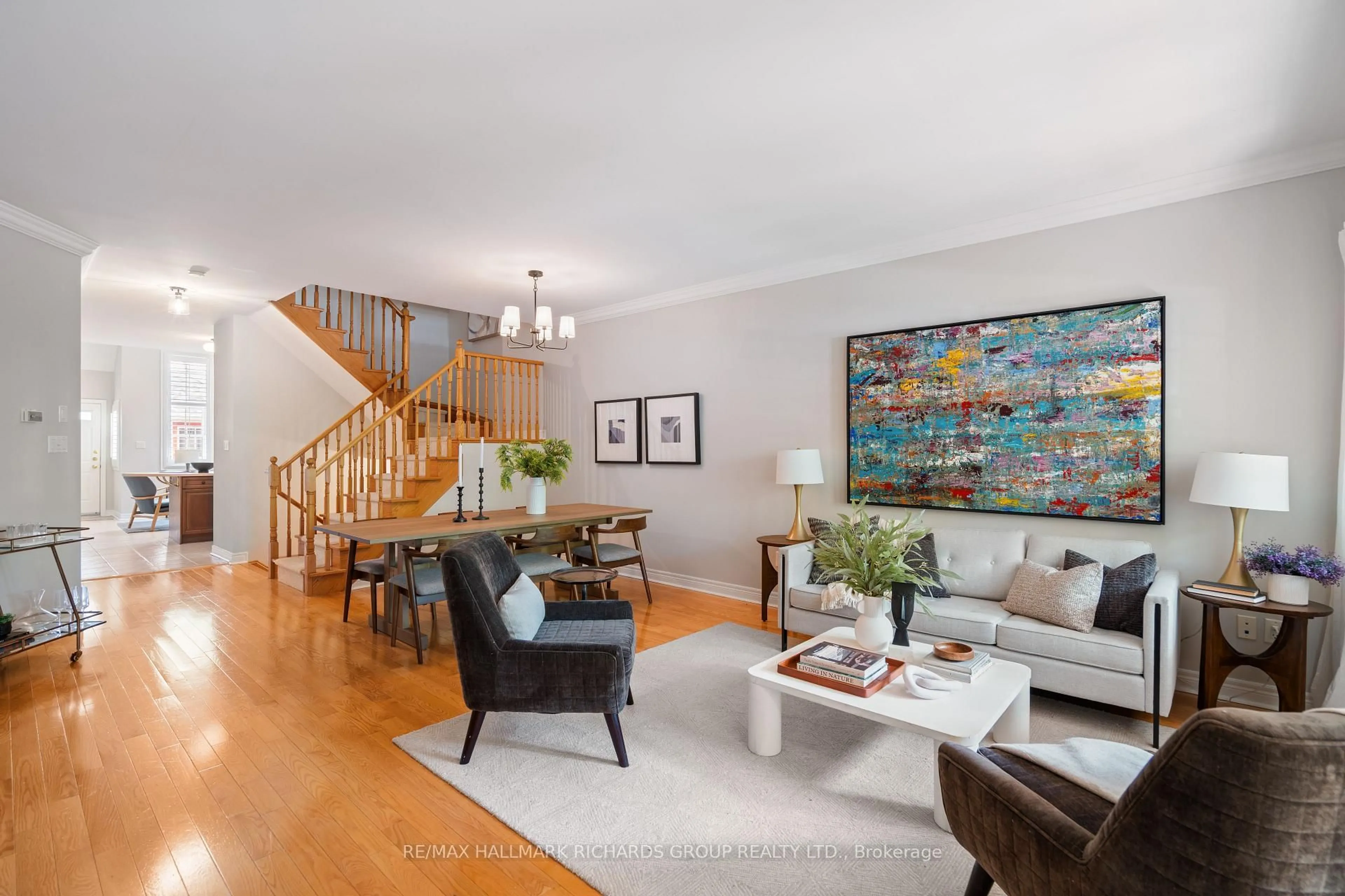 Living room with furniture, wood/laminate floor for 111 Winners Circ, Toronto Ontario M4L 3Y7