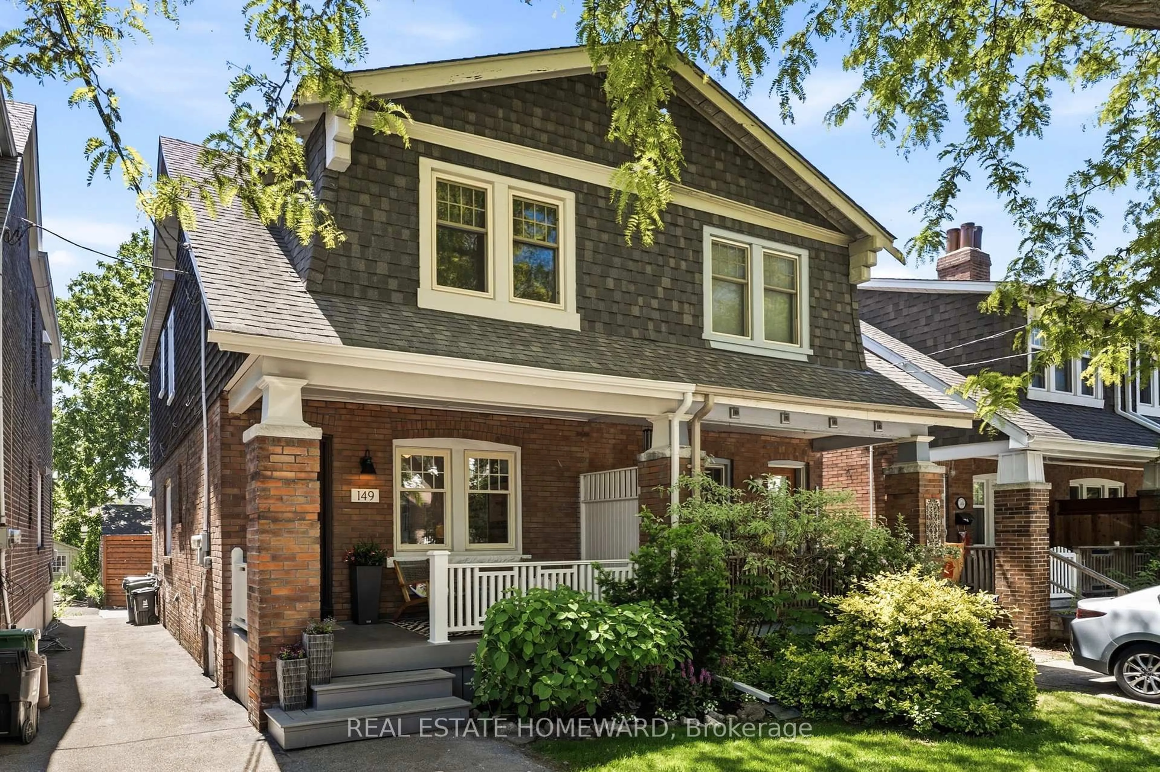 Home with brick exterior material, street for 149 Wolverleigh Blvd, Toronto Ontario M4J 1R8
