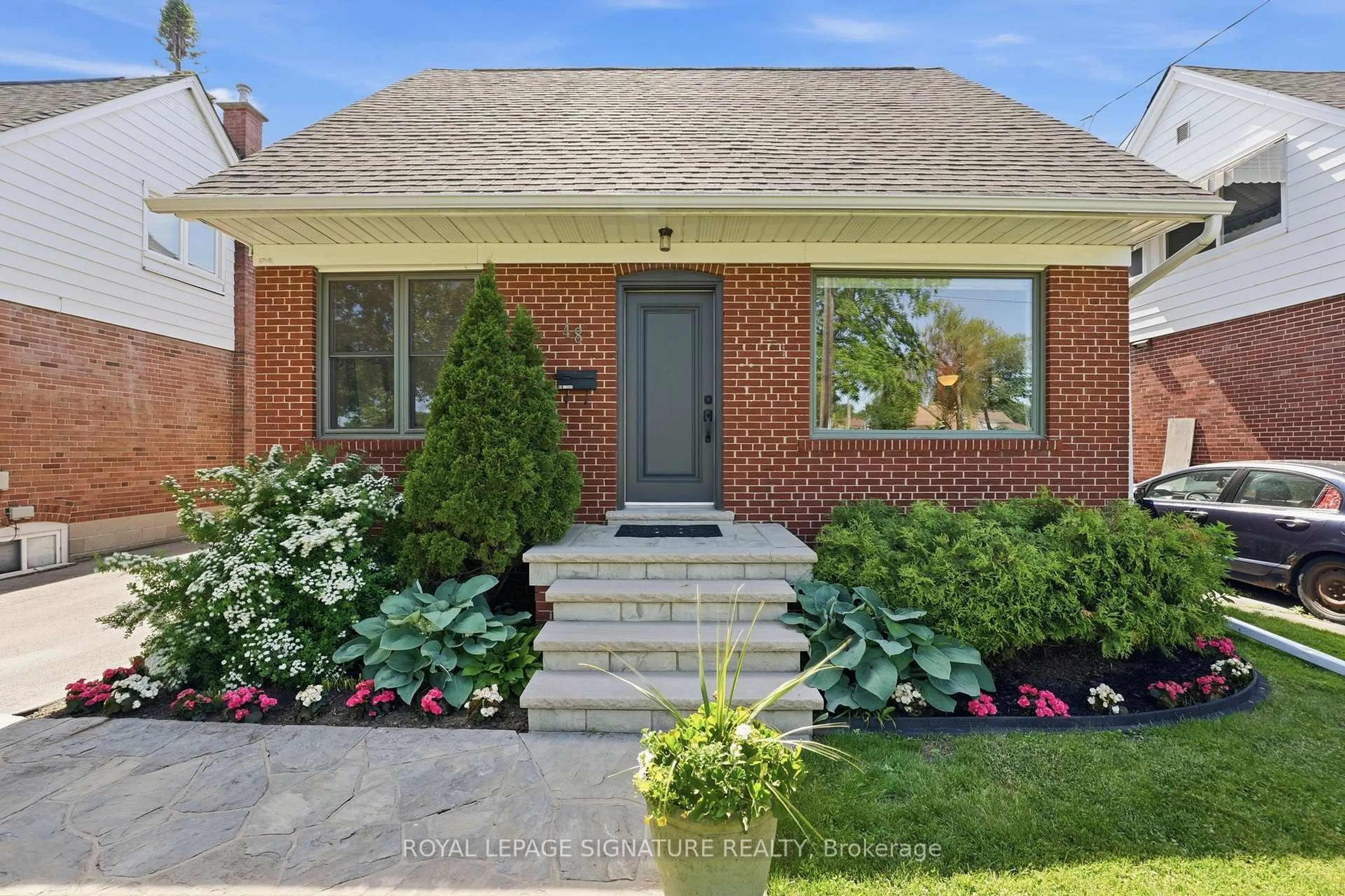 Home with brick exterior material, street for 48 Tower Dr, Toronto Ontario M1R 3N9