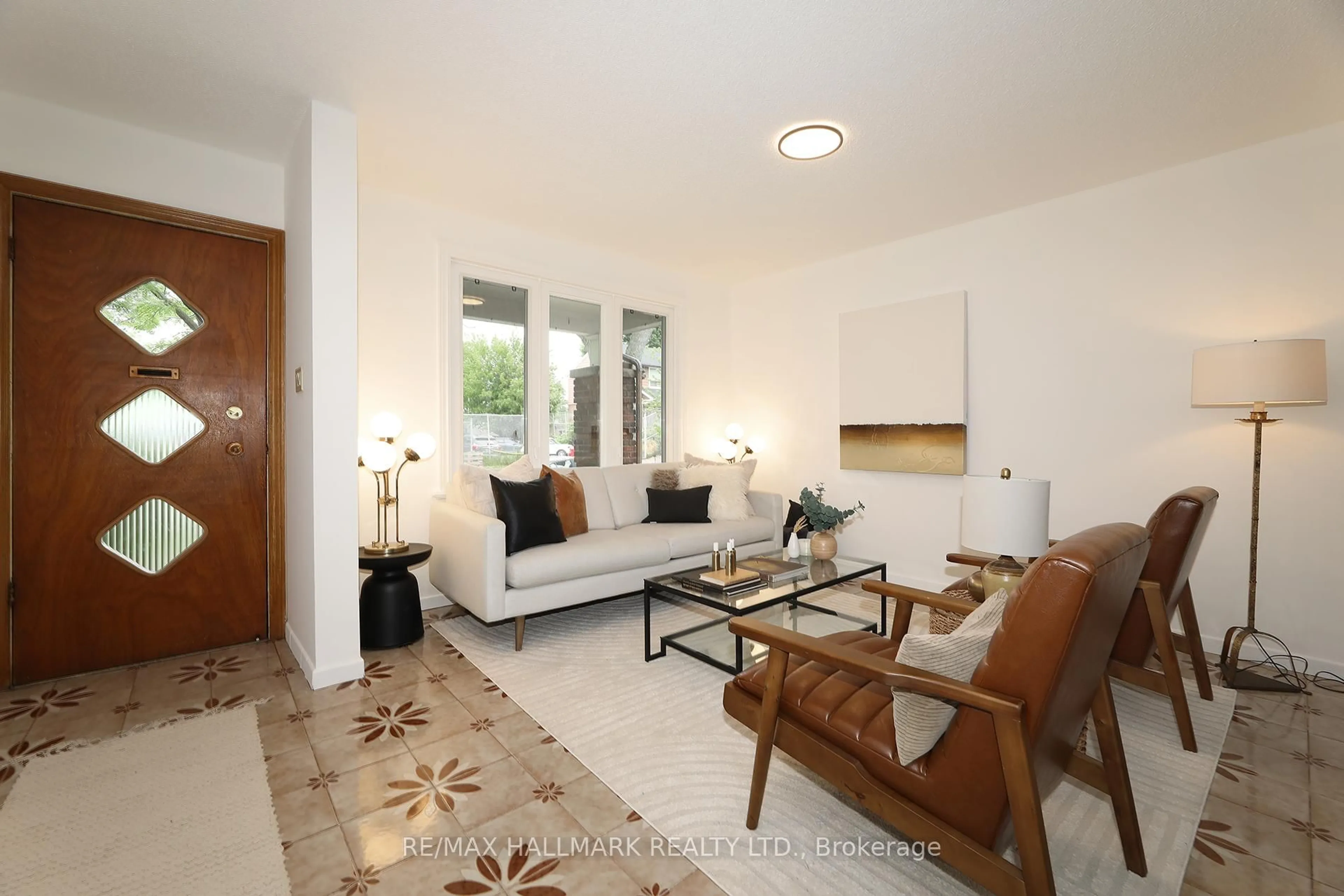 Living room with furniture, ceramic/tile floor for 259 Wolverleigh Blvd, Toronto Ontario M4C 1S3