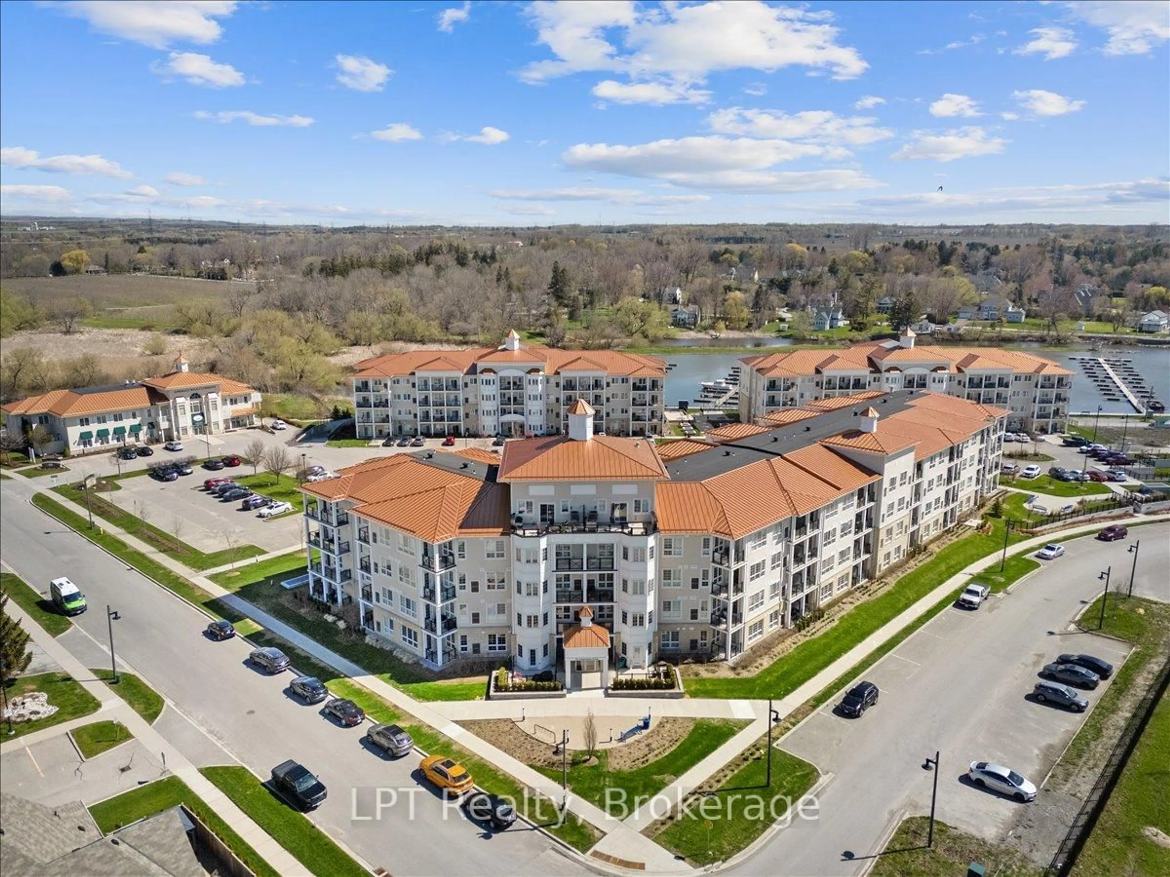 A pic from outside/outdoor area/front of a property/back of a property/a pic from drone, city buildings view from balcony for 50 Lakebreeze Dr #102, Clarington Ontario L1B 0V9
