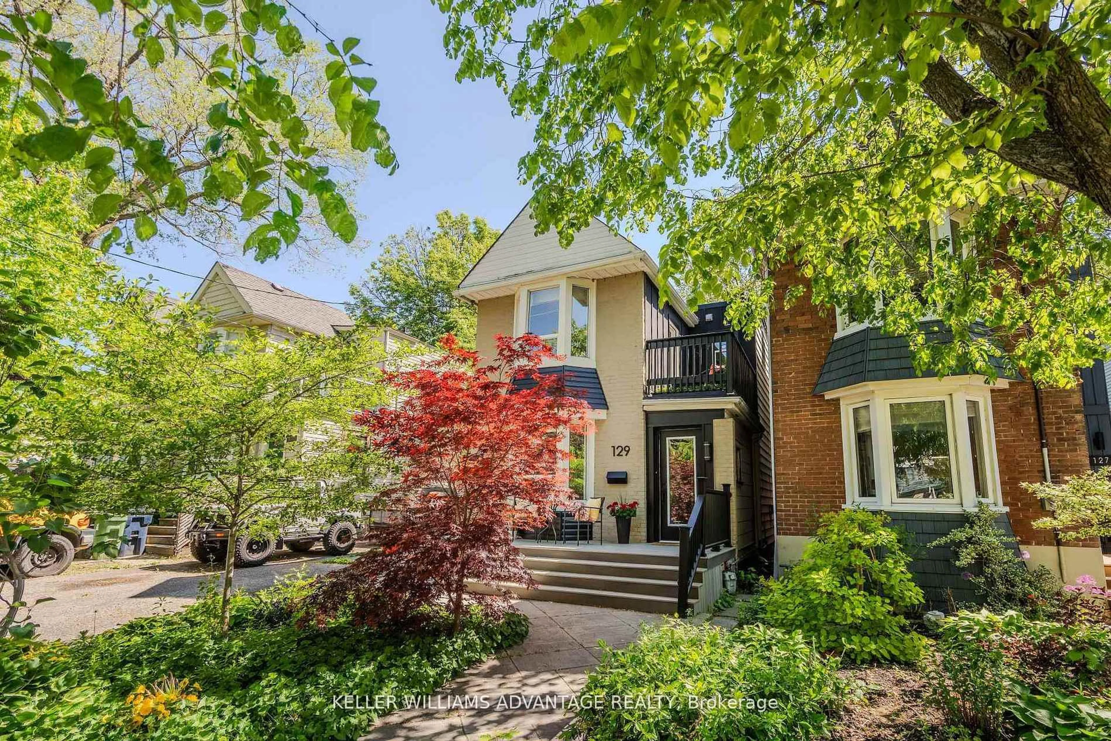 Home with brick exterior material, street for 129 Woodfield Rd, Toronto Ontario M4L 2W5
